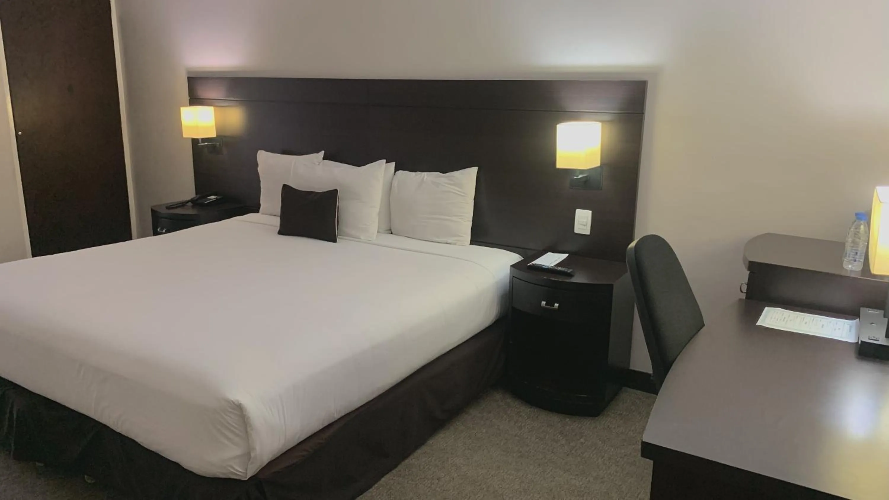 Bed in HOTEL CHACAO SUITES