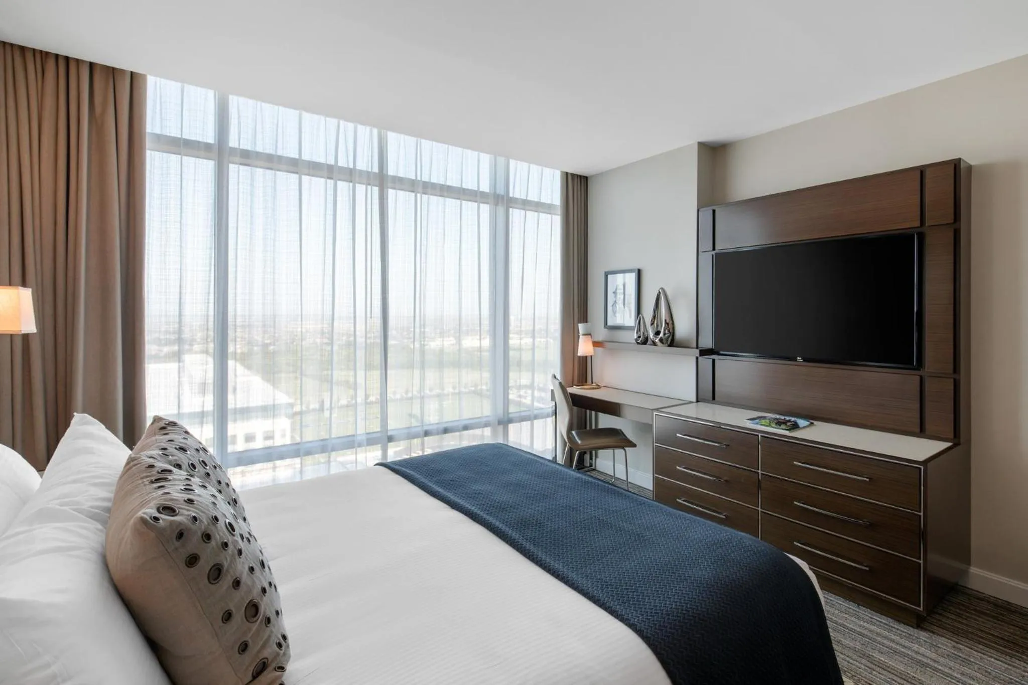 Photo of the whole room, Bed in Omni Frisco at The Star