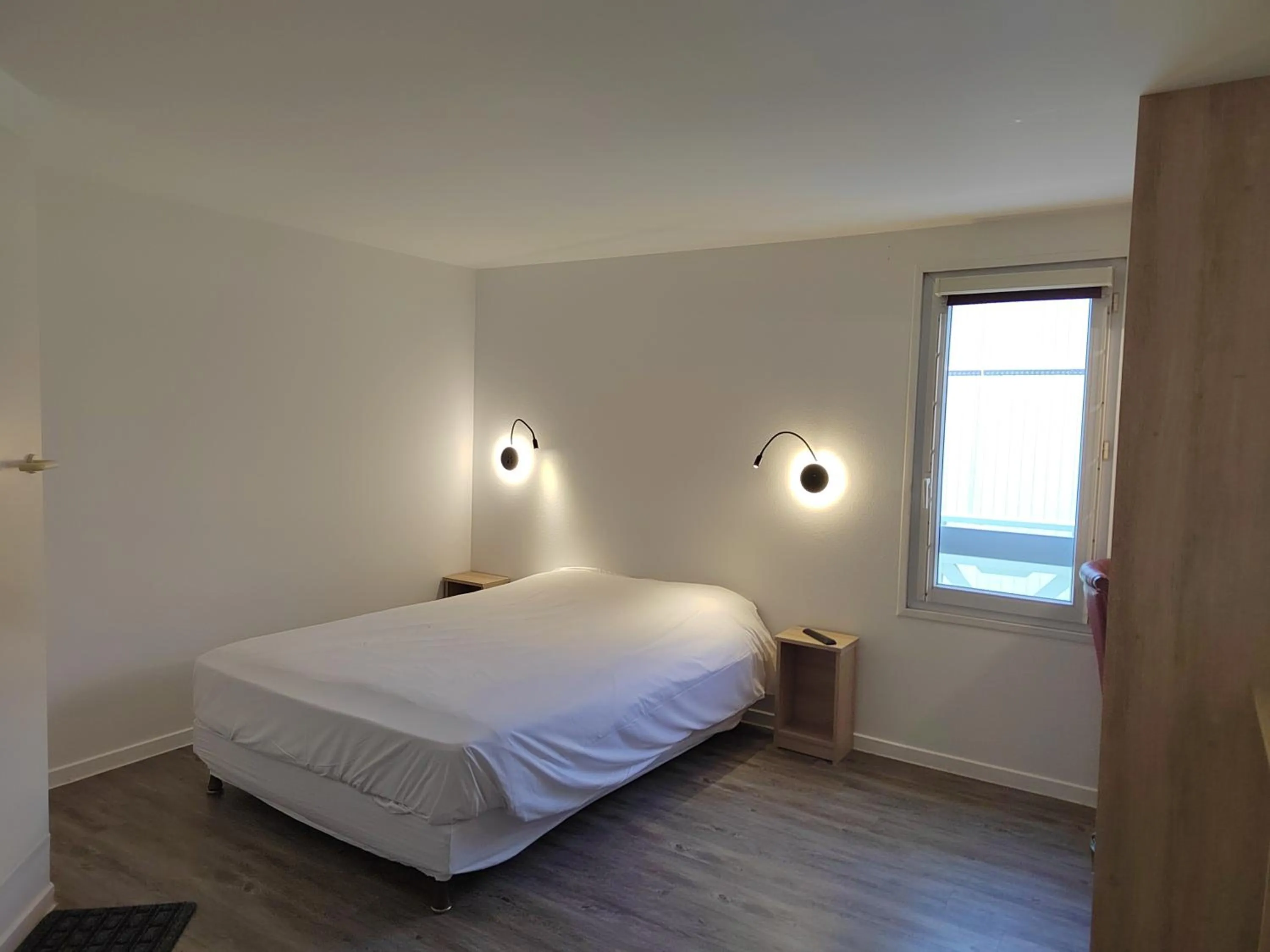 Bed in FASTHOTEL PARIS OUEST BOUAFLE