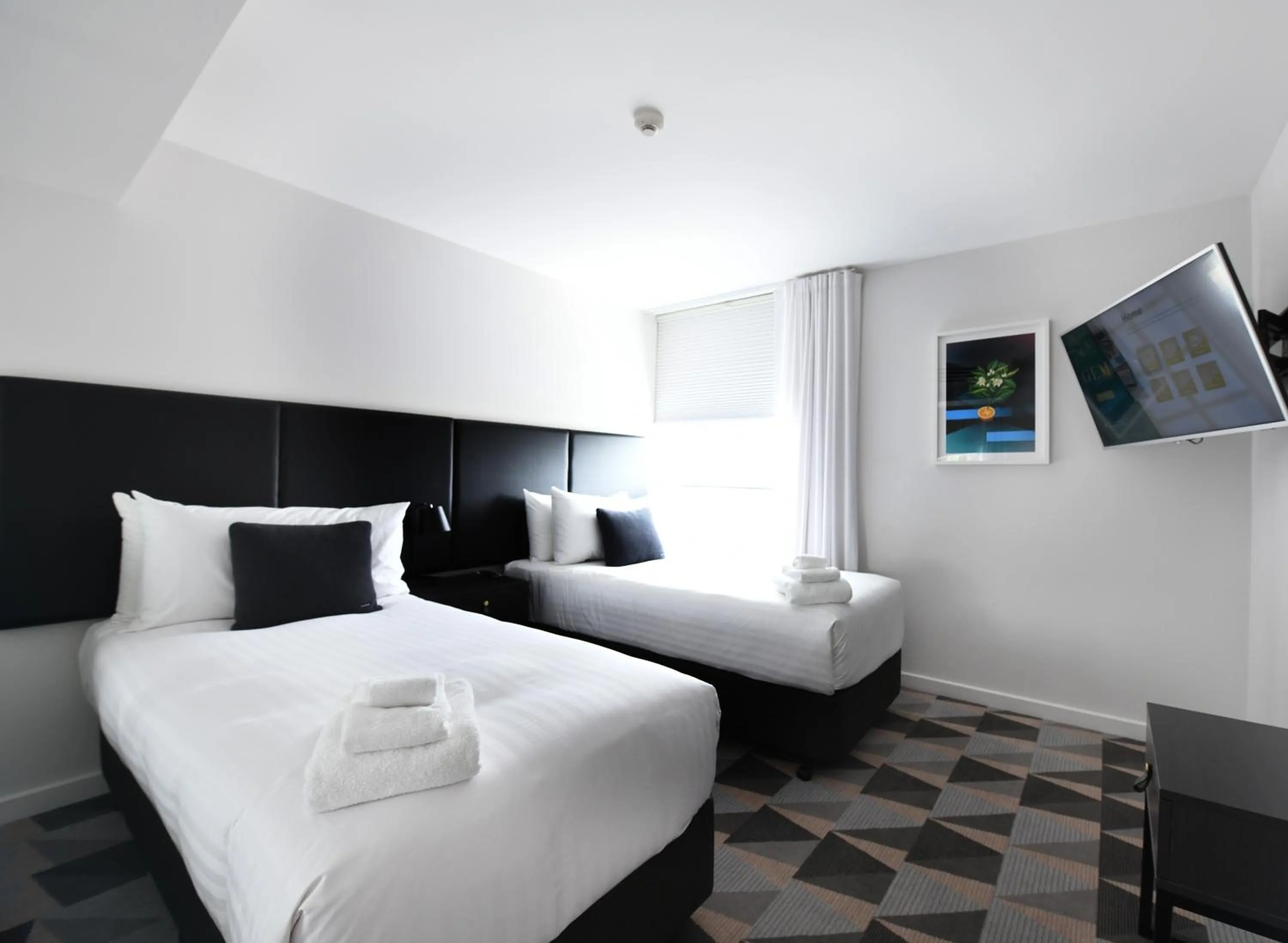 Bed in The Gem Hotel