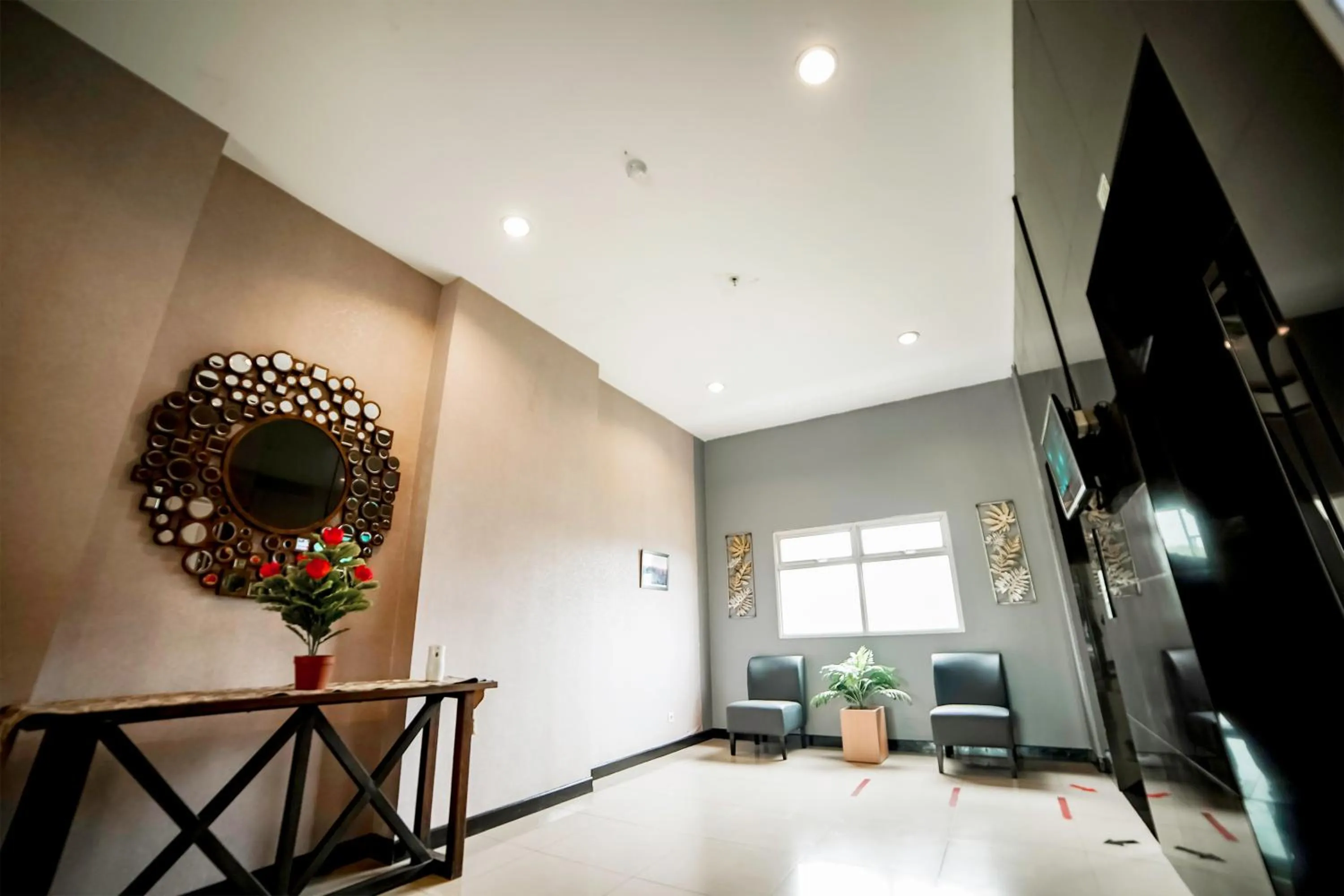Lobby or reception in Apartemen Gunung Putri Square by Sirooms