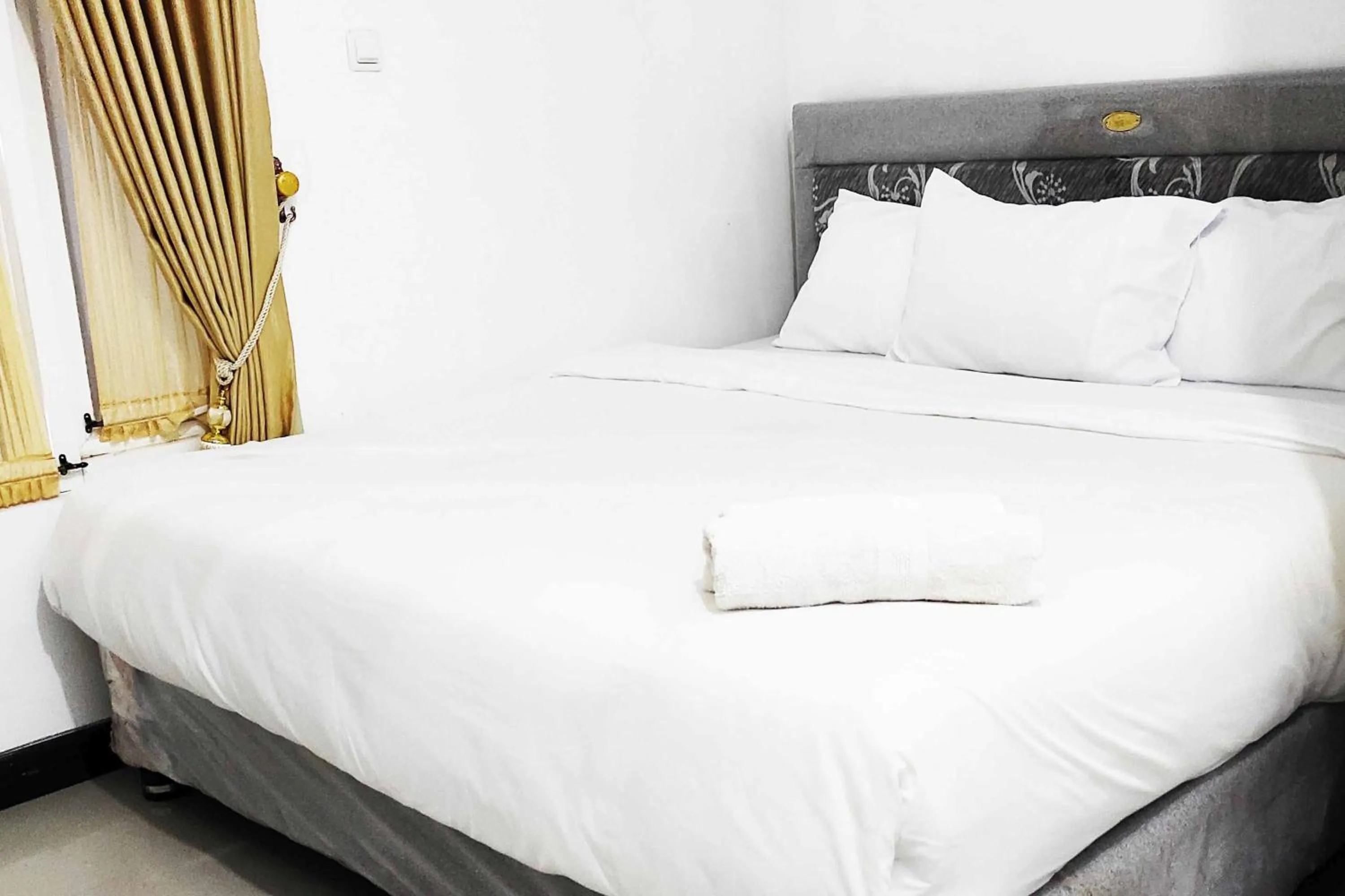 Bed in Pertiwi Homestay Near Museum Angkut Batu Mitra RedDoorz