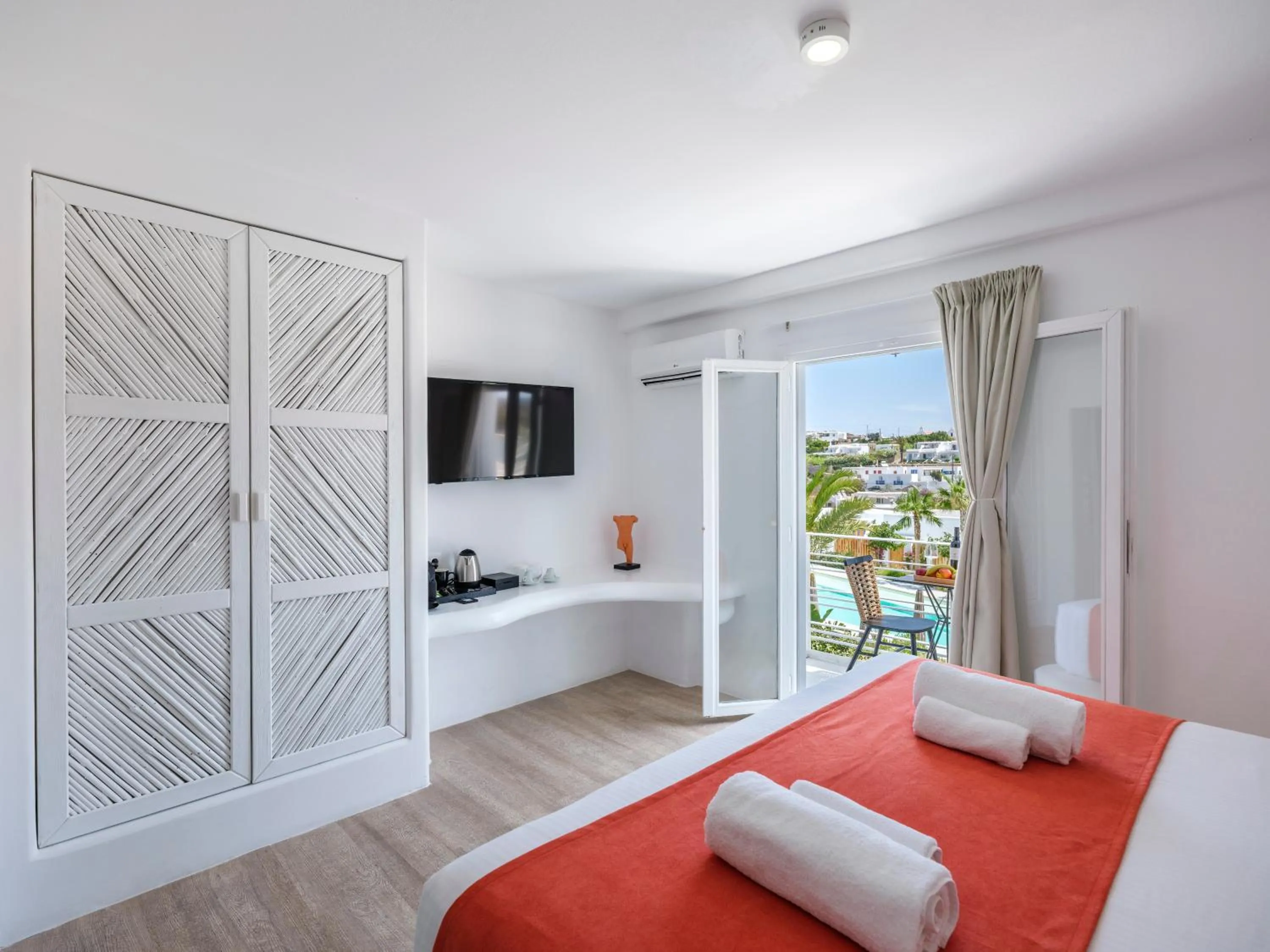 Communal lounge/ TV room, Bed in Akkadian LGBT Boutique Hotel