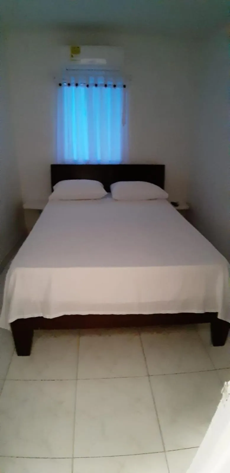 Bed in Tita’s Airport Hotel