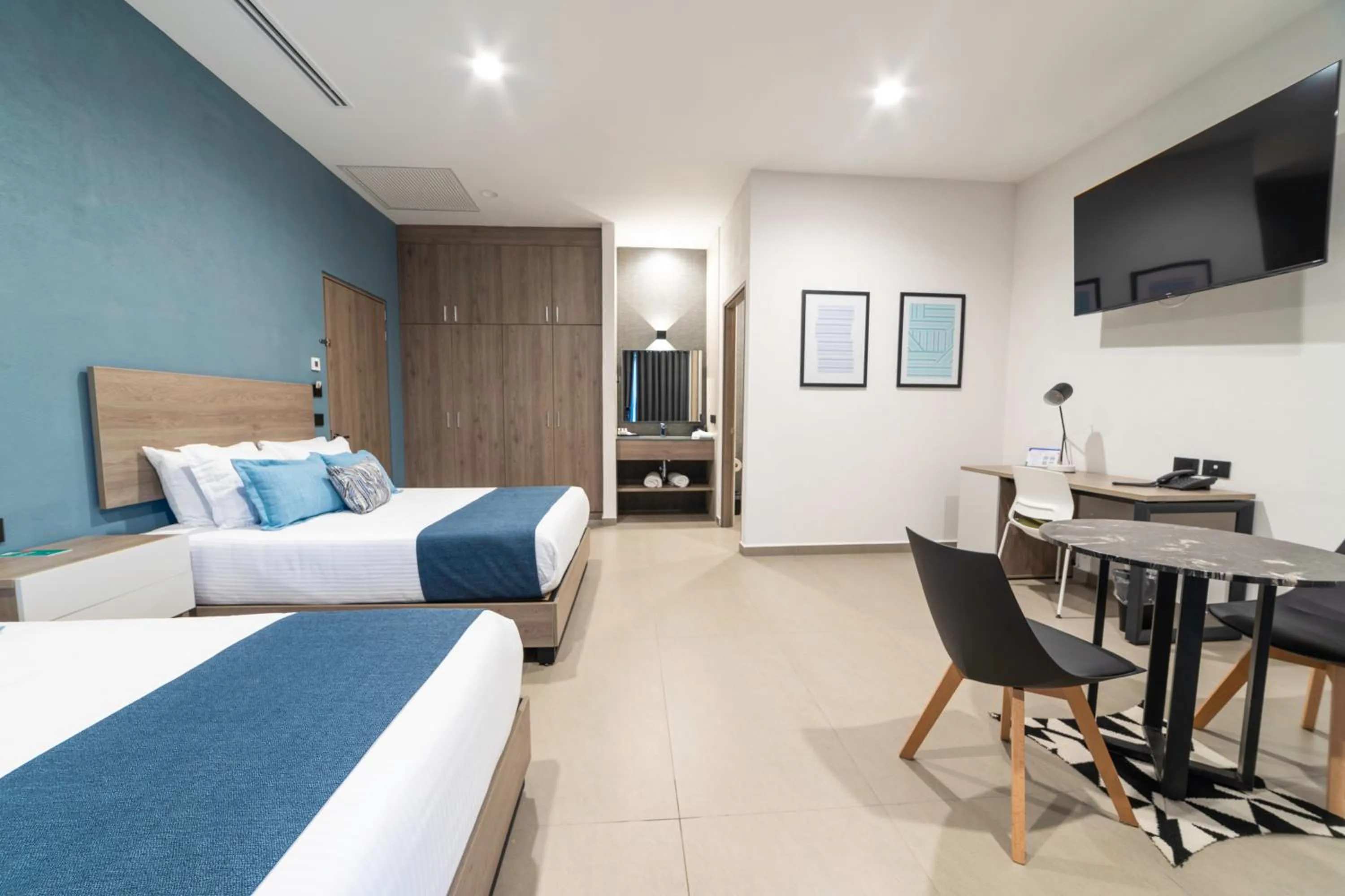 Living room, Bed in TH HOTEL & VIVIENDA