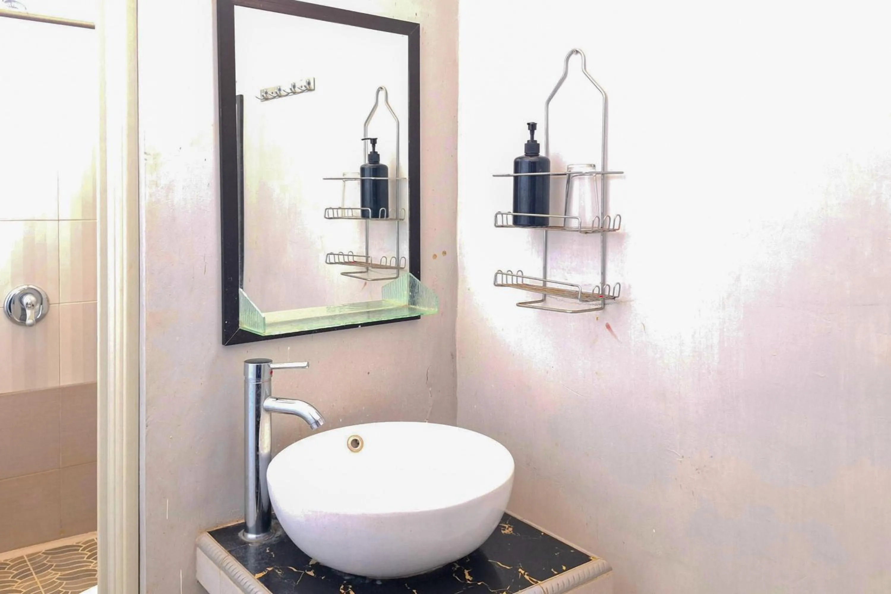 Bathroom in Urbanview The Halona near Jawa Timur Park 4