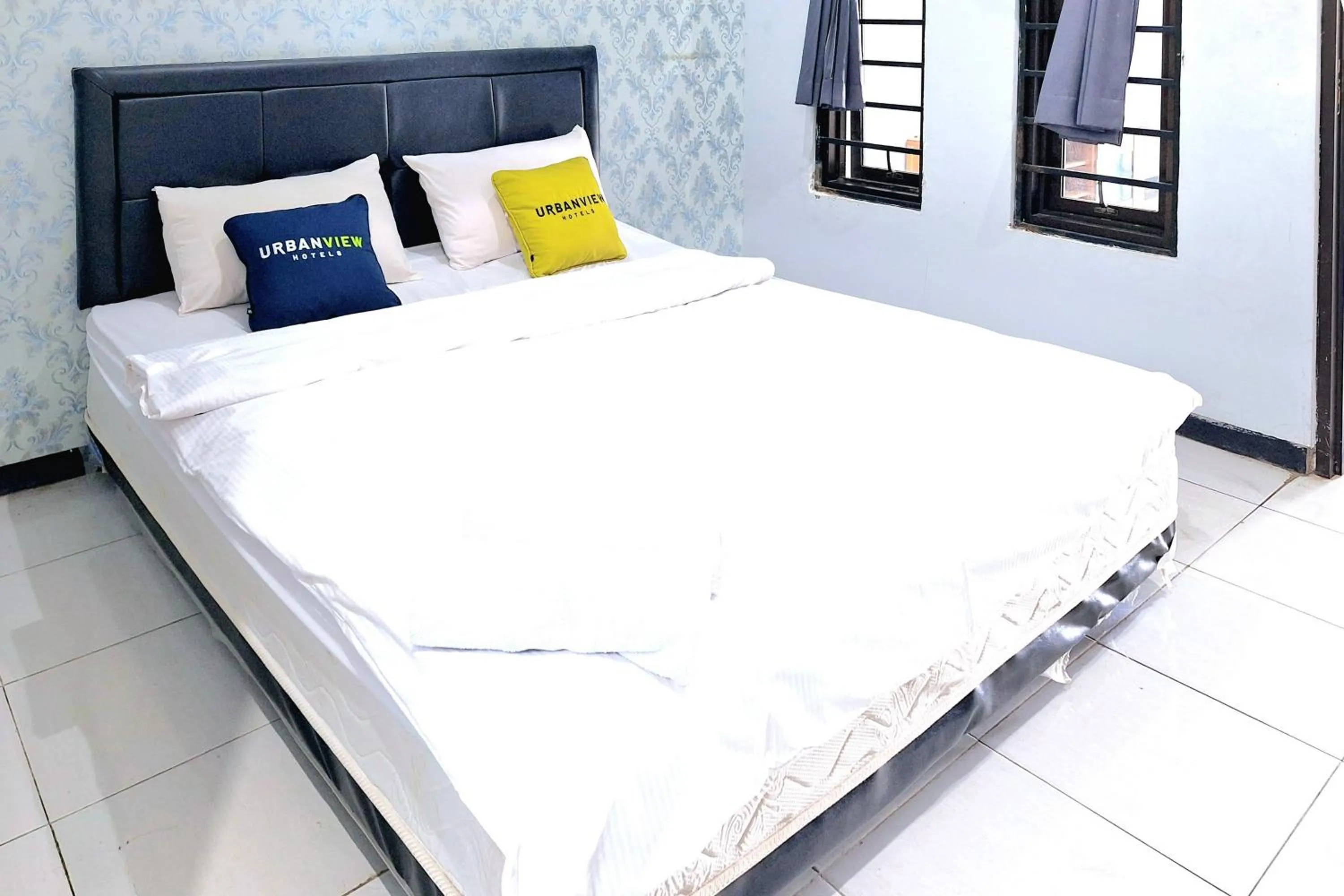Bedroom, Bed in Urbanview The Halona near Jawa Timur Park 4