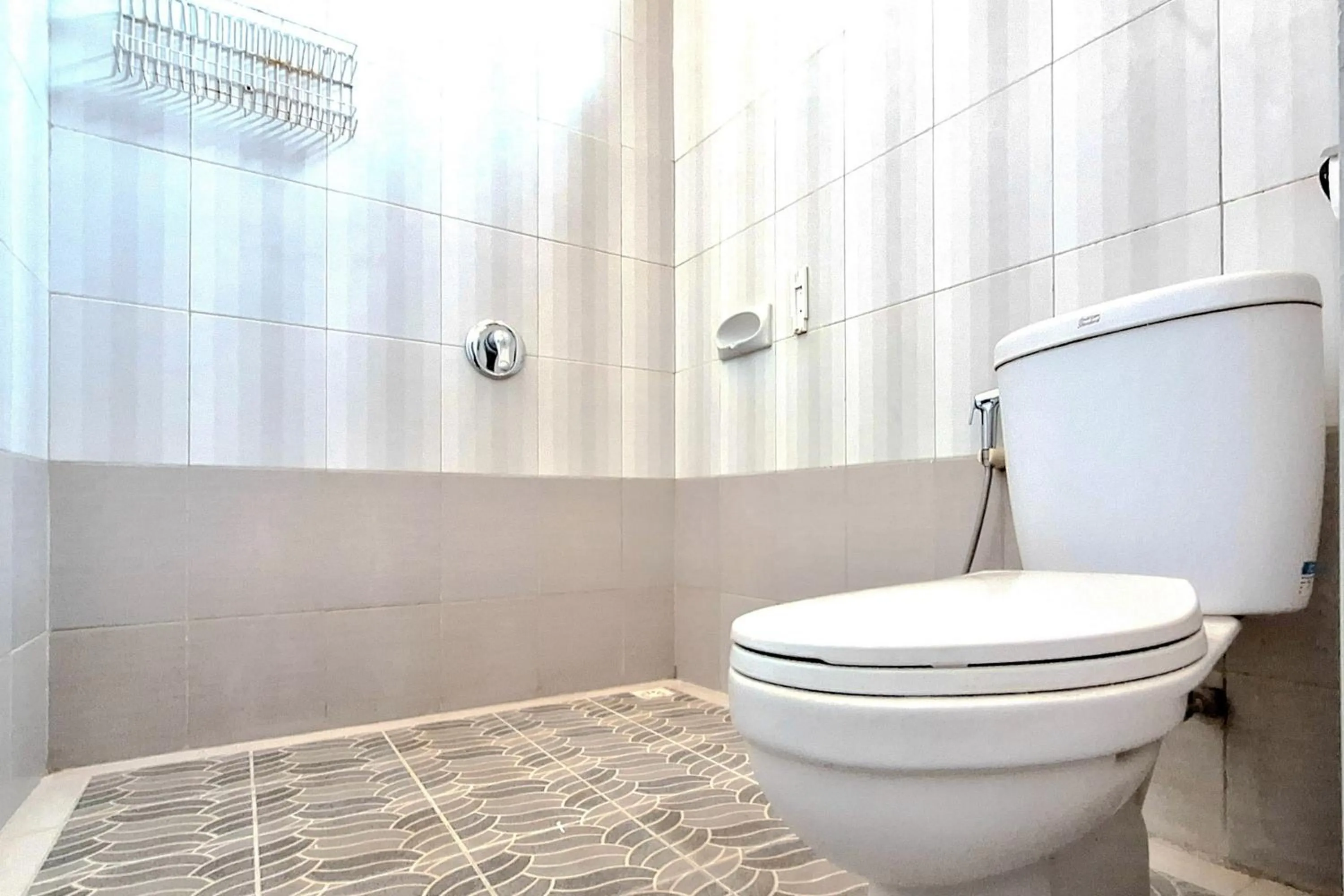 Bathroom in Urbanview The Halona near Jawa Timur Park 4