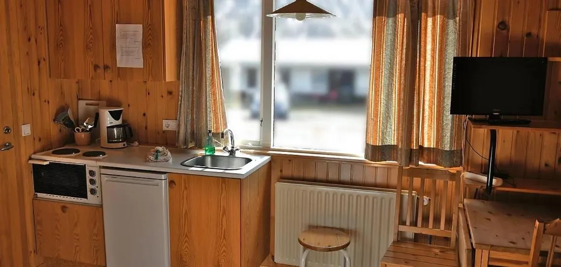 Kitchen or kitchenette in Kaffi Holar Cottages and Apartments