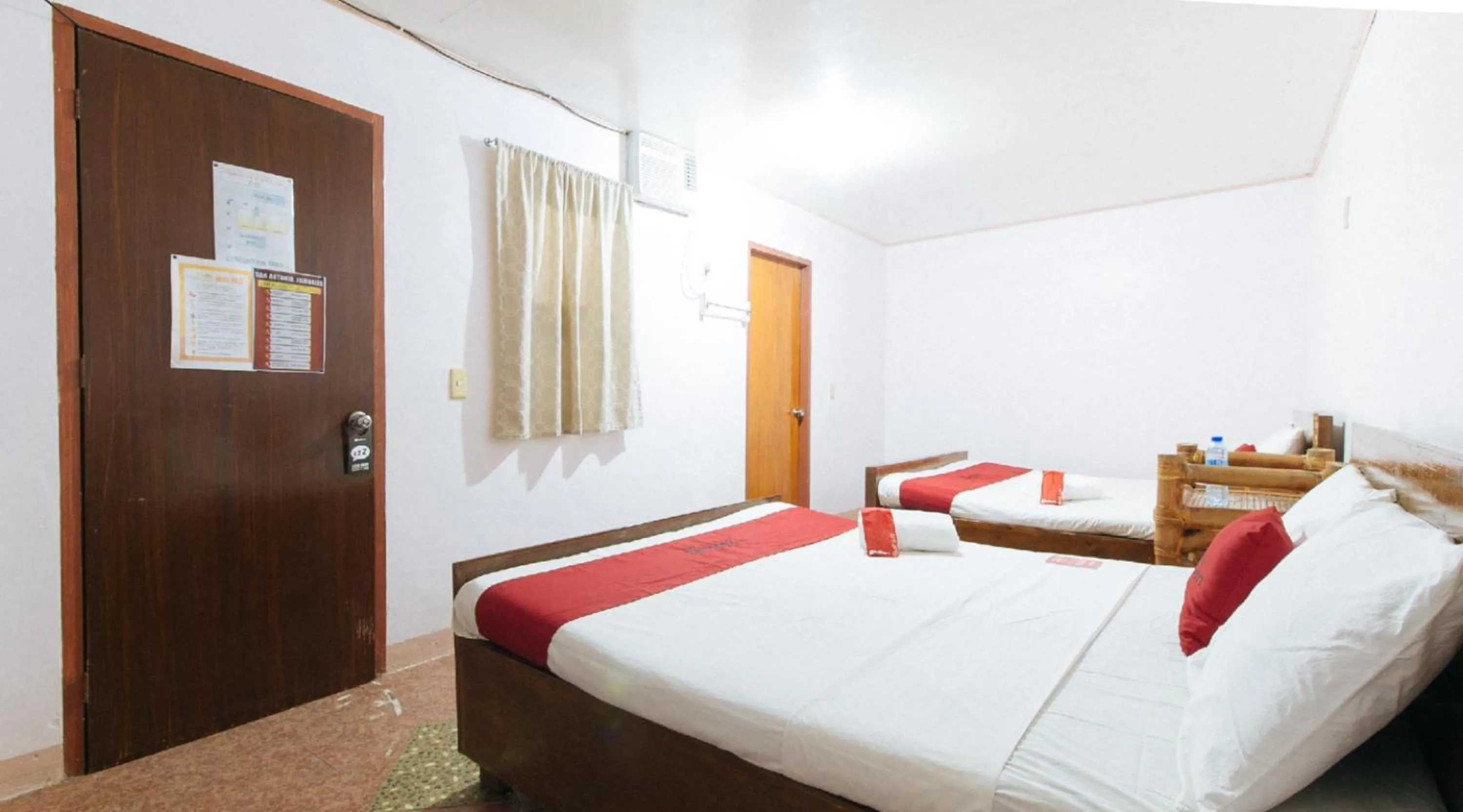 Bedroom, Bed in RedDoorz Hostel at Megans Paradisio Beach Resort