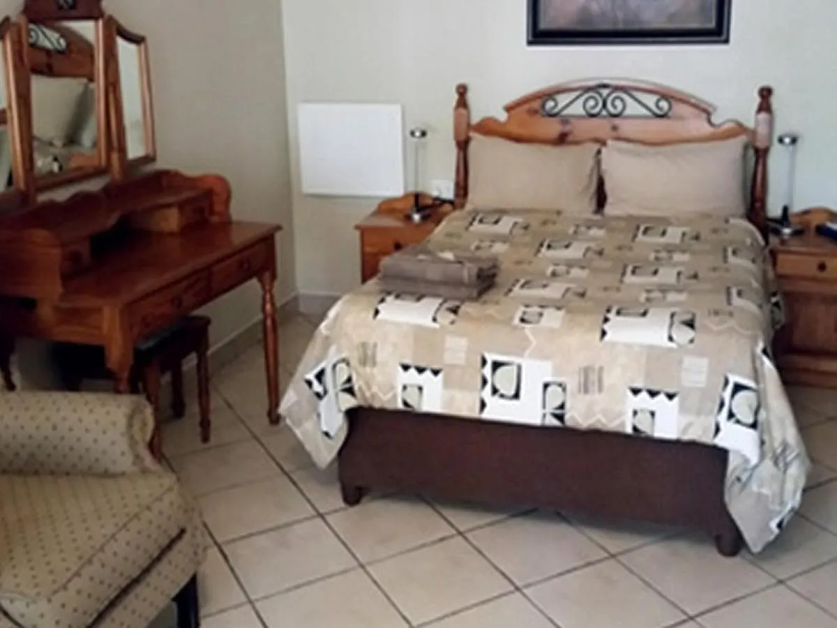 Bed in Country Blue Luxury Guest House