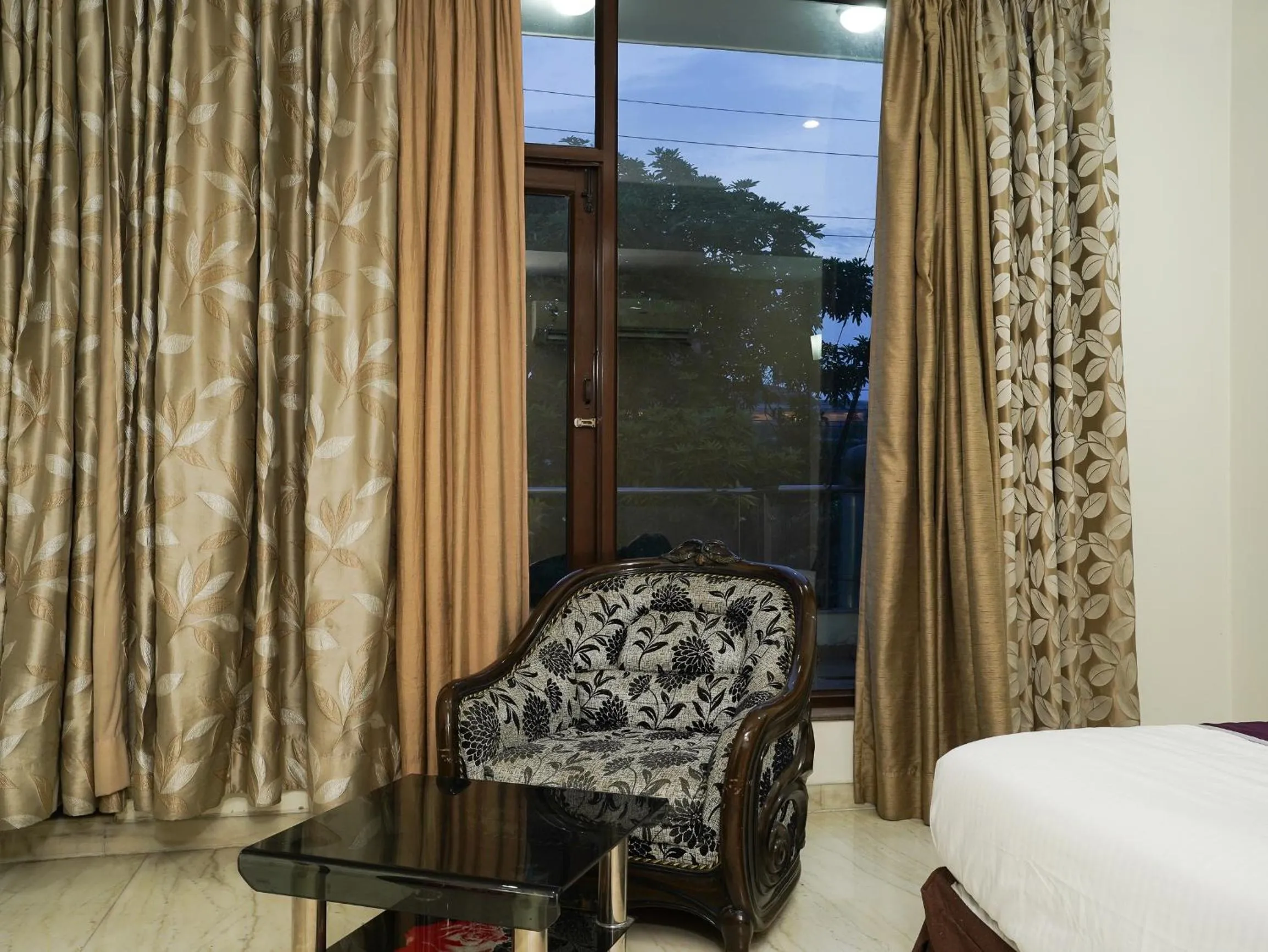Seating area, Bed in Lime Tree Hotel Sushant Lok Gurgaon Sector 29 Next to IFFCO CHOWK metro