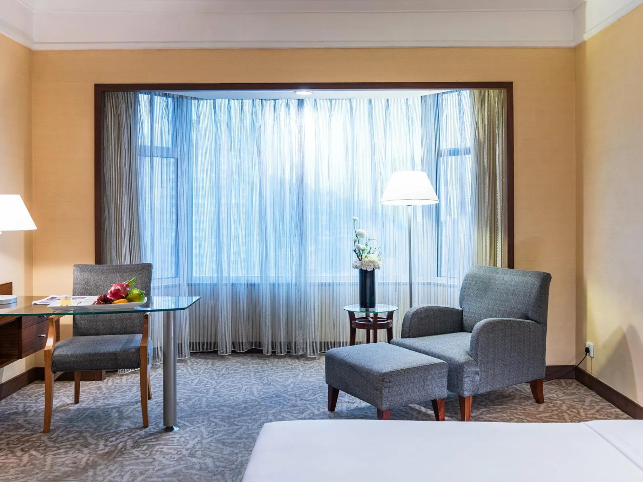 Seating area, Bed in Millennium Harbourview Hotel Xiamen