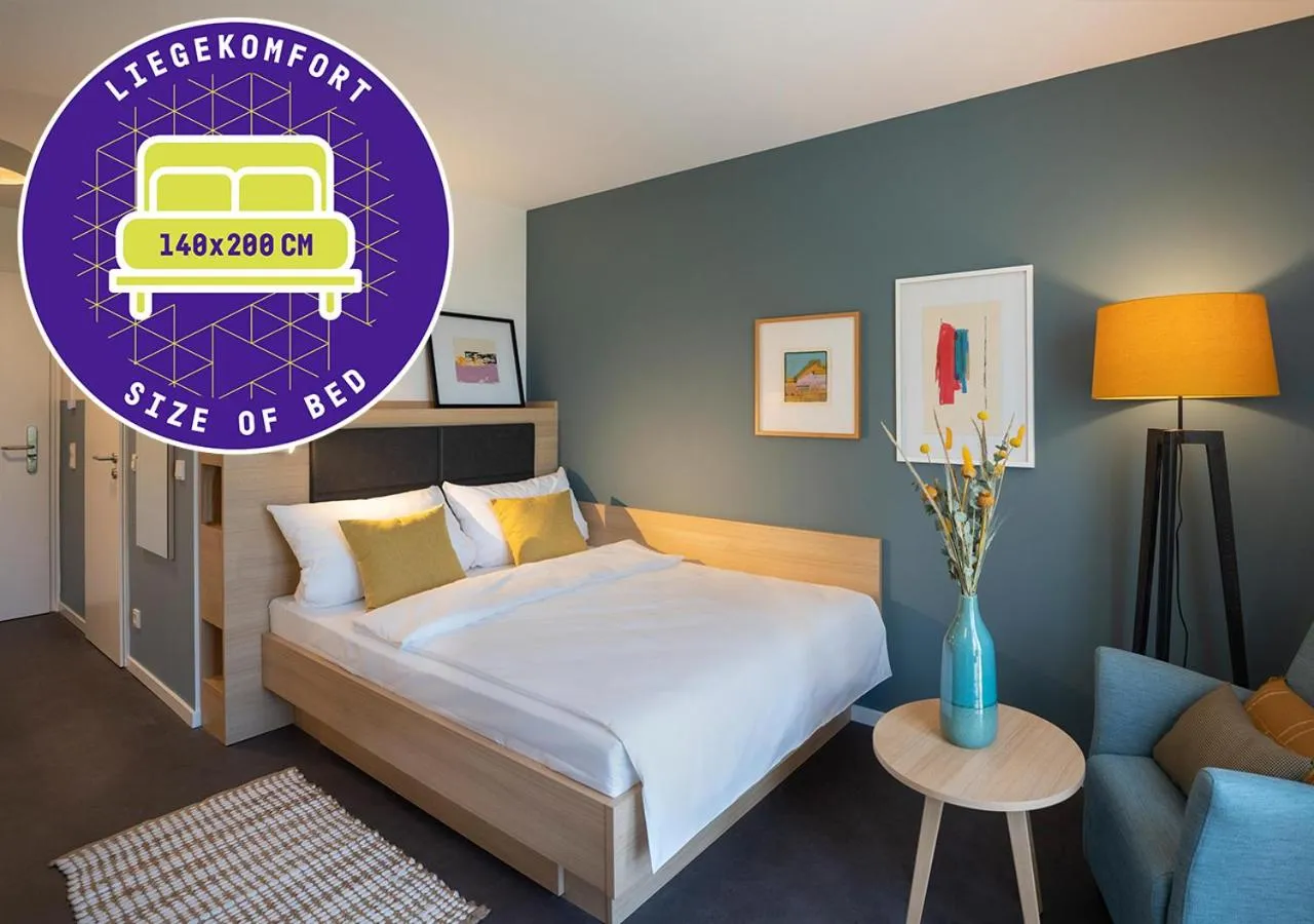 Bed in KONCEPT HOTEL Neue Horizonte