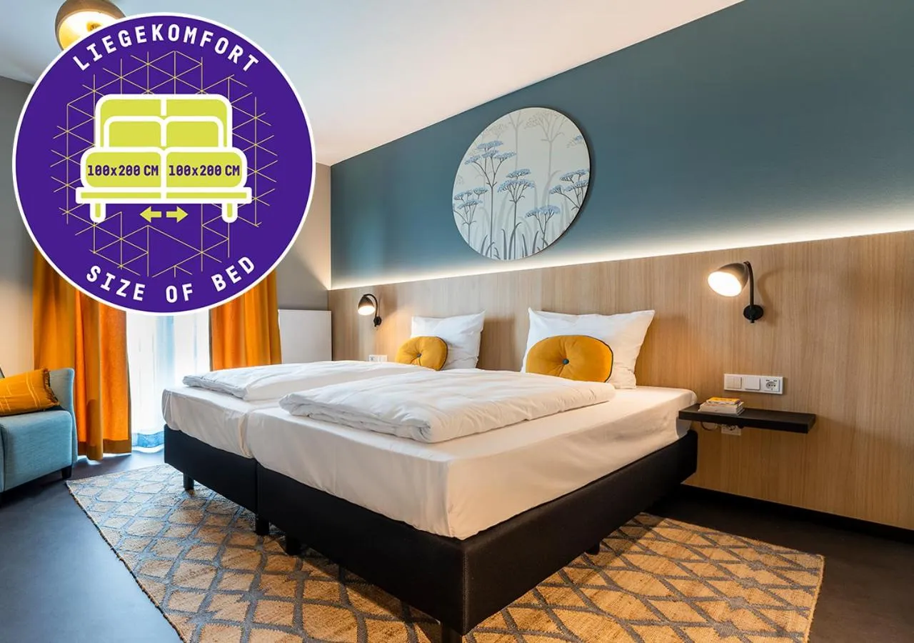 Bed in KONCEPT HOTEL Neue Horizonte