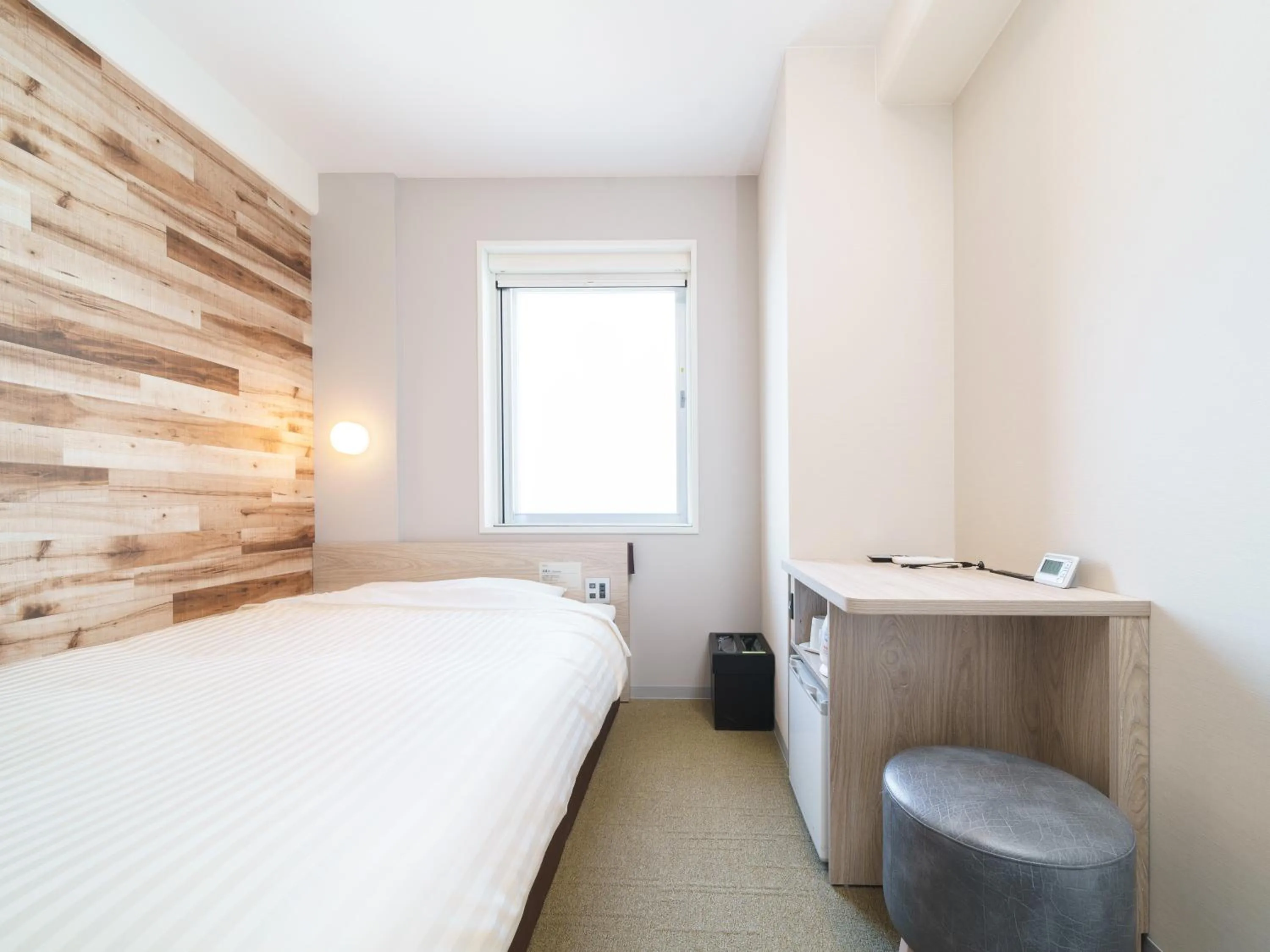 Bed in Super Hotel Kyoto Shijokawaramachi