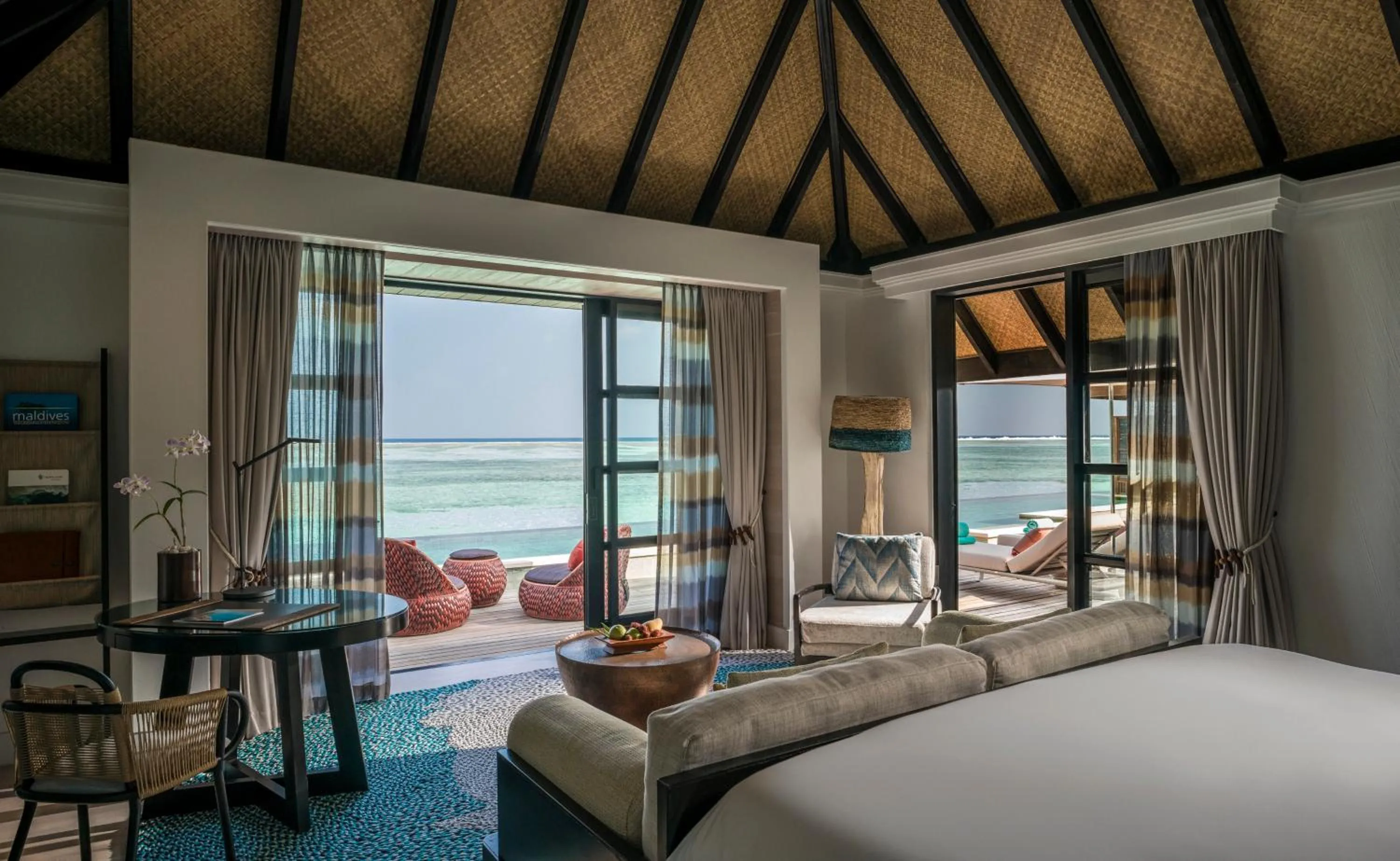 Seating area, Bed in Four Seasons Resort Maldives at Kuda Huraa