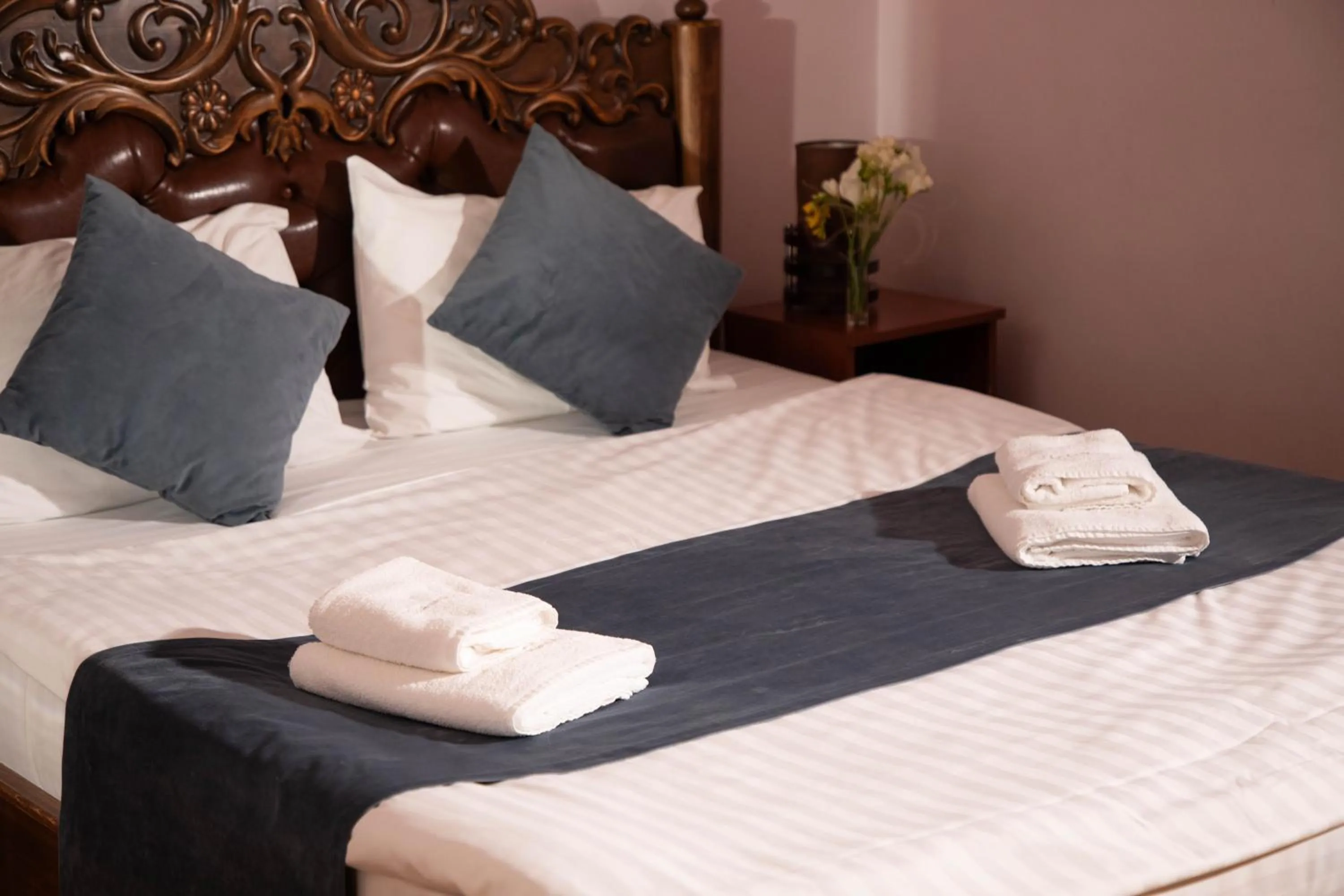 towels, Bed in Casanova Inn - Boutique Hotel