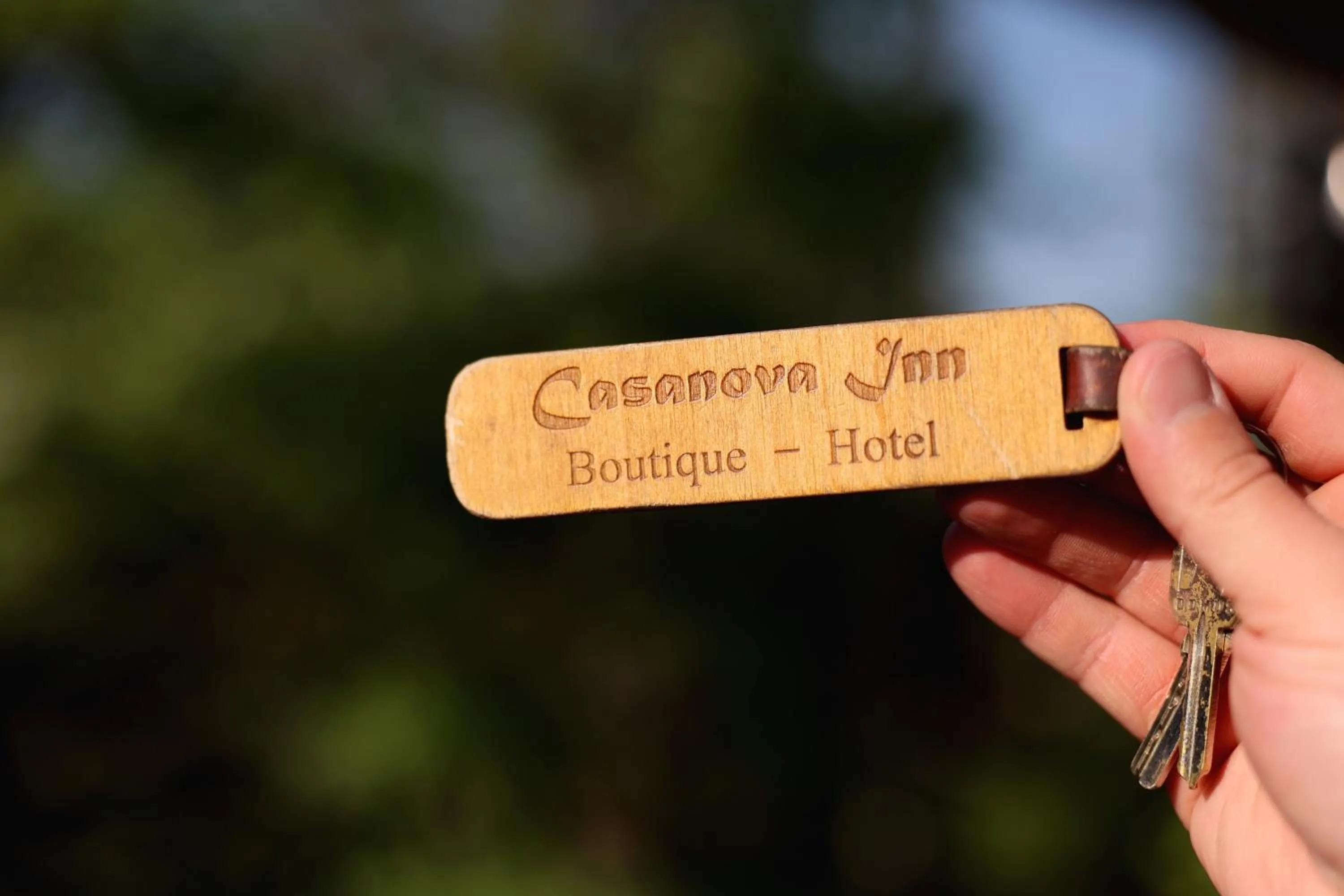 Property logo or sign in Casanova Inn - Boutique Hotel