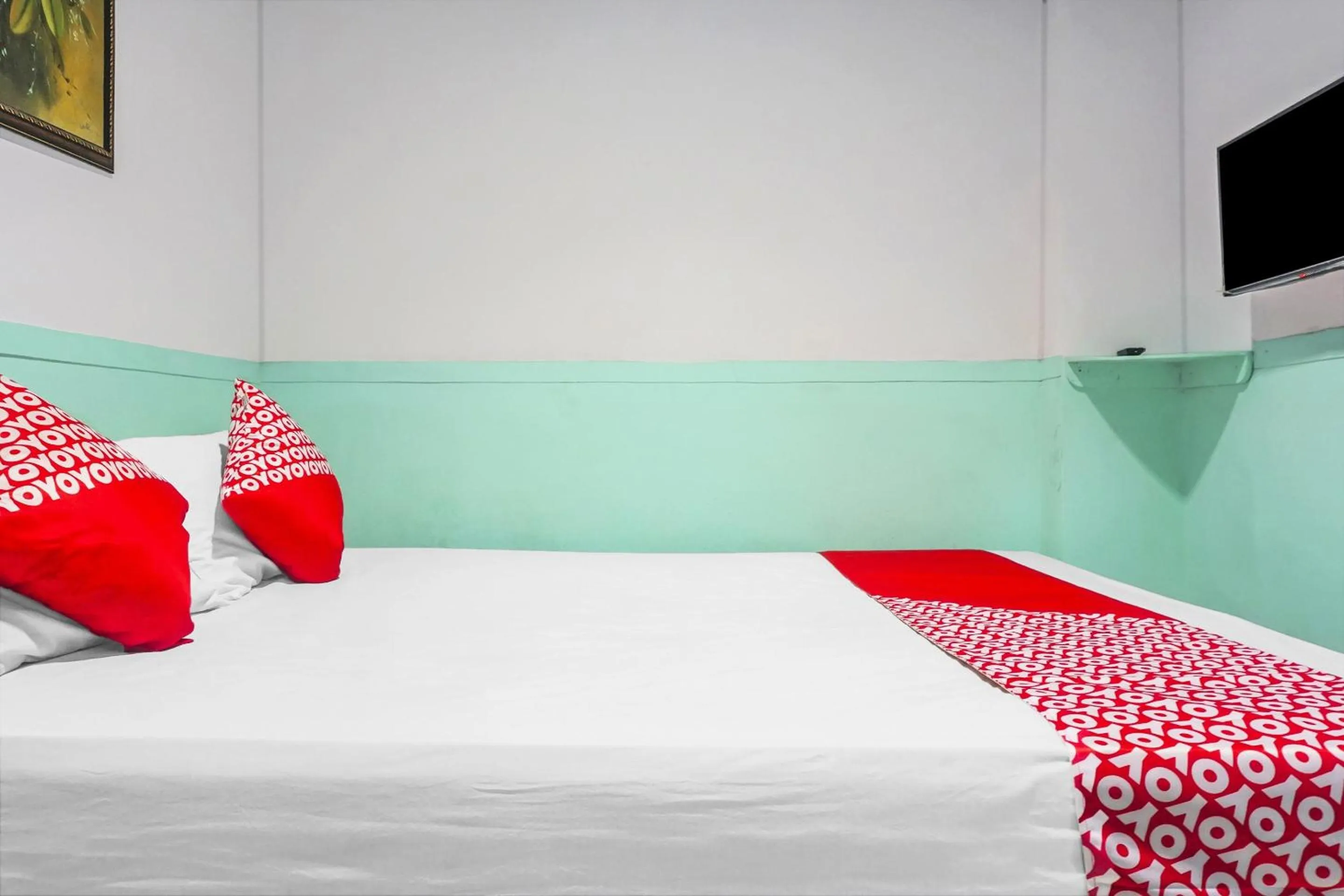 Bedroom in Hotel O Wisma Favorite Makassar Near Benteng Rotterdam