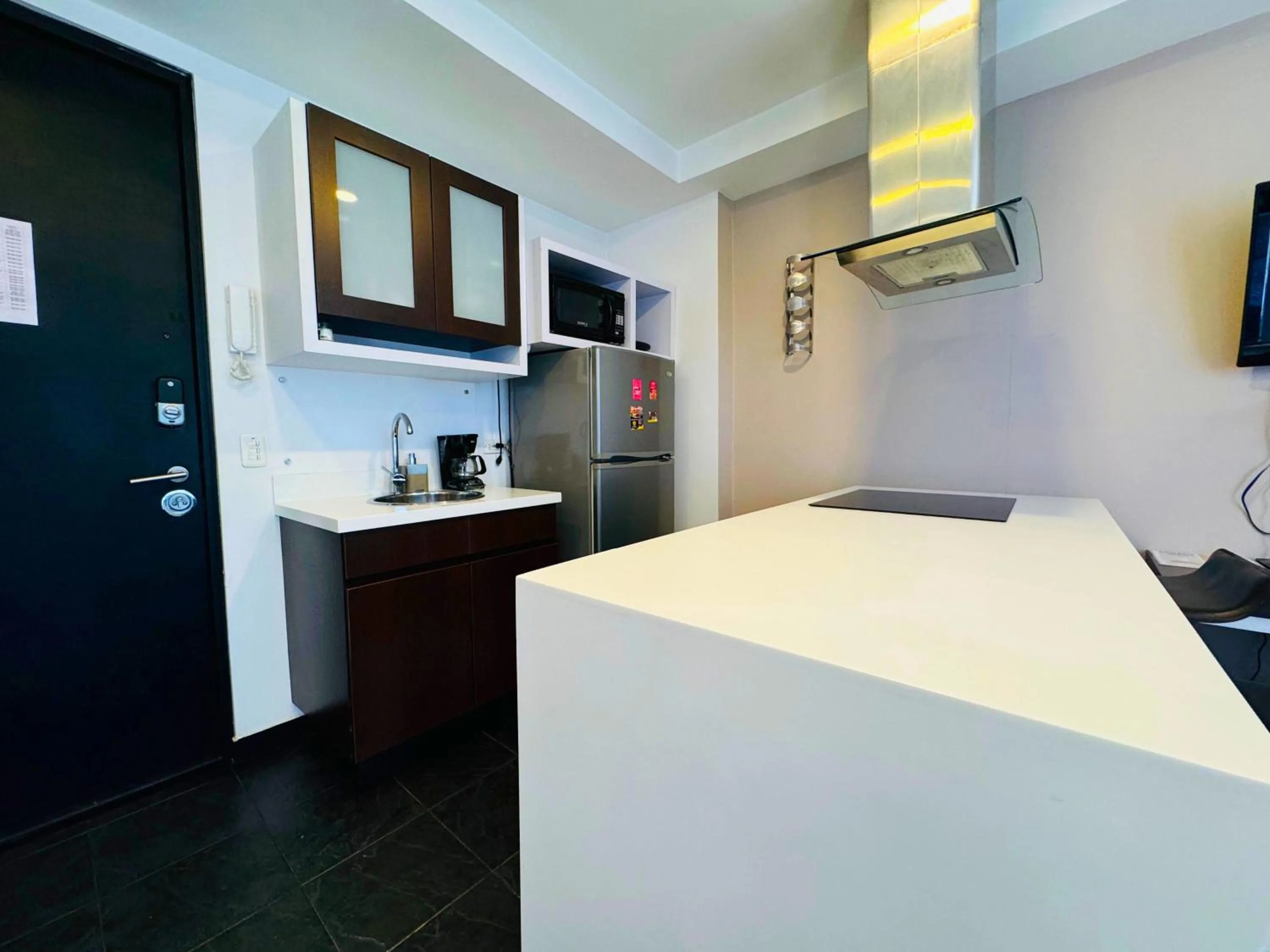 Kitchen or kitchenette, Bed in Aparta Suite Continental Bogotá