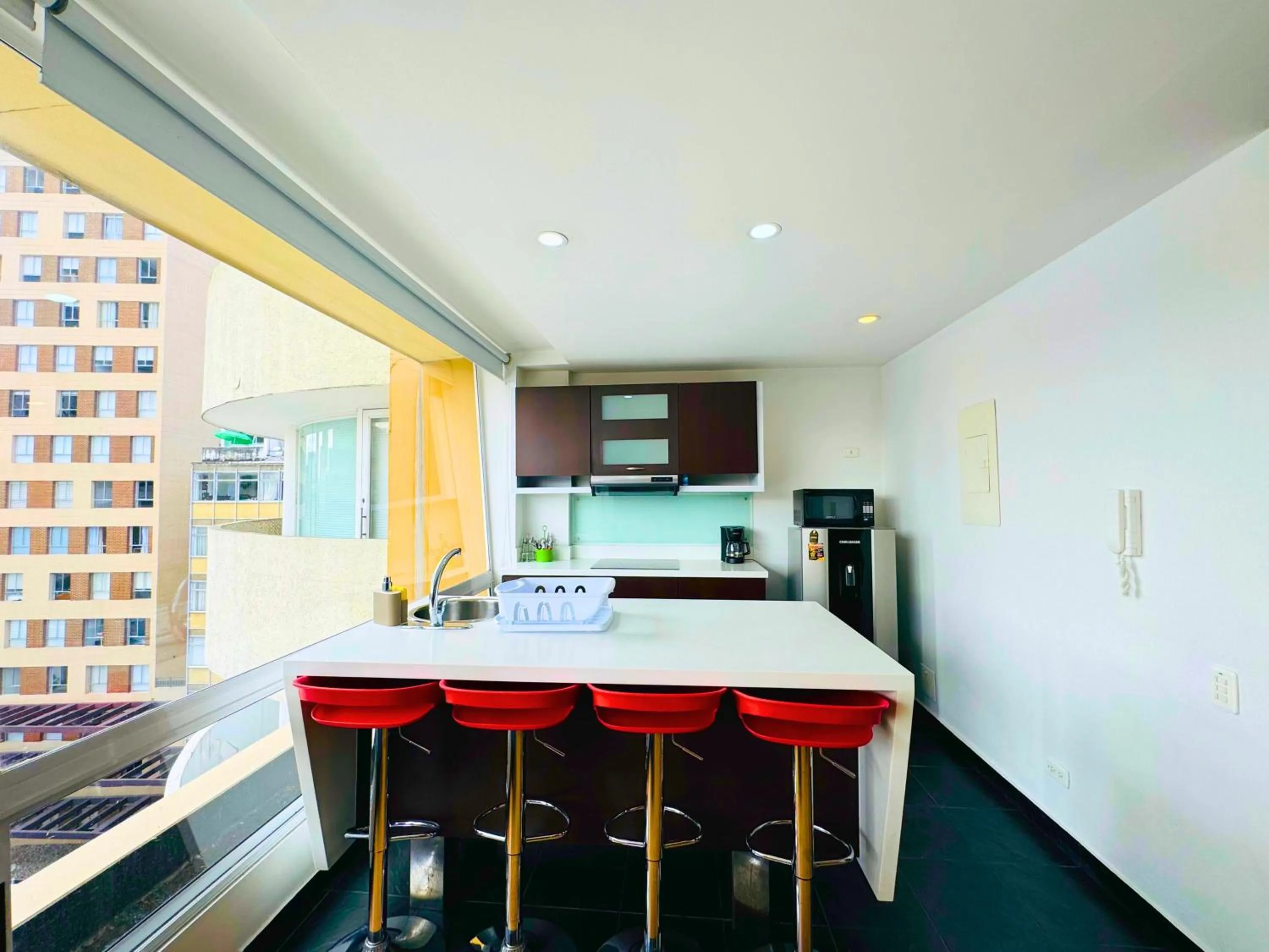 Kitchen or kitchenette in Aparta Suite Continental Bogotá