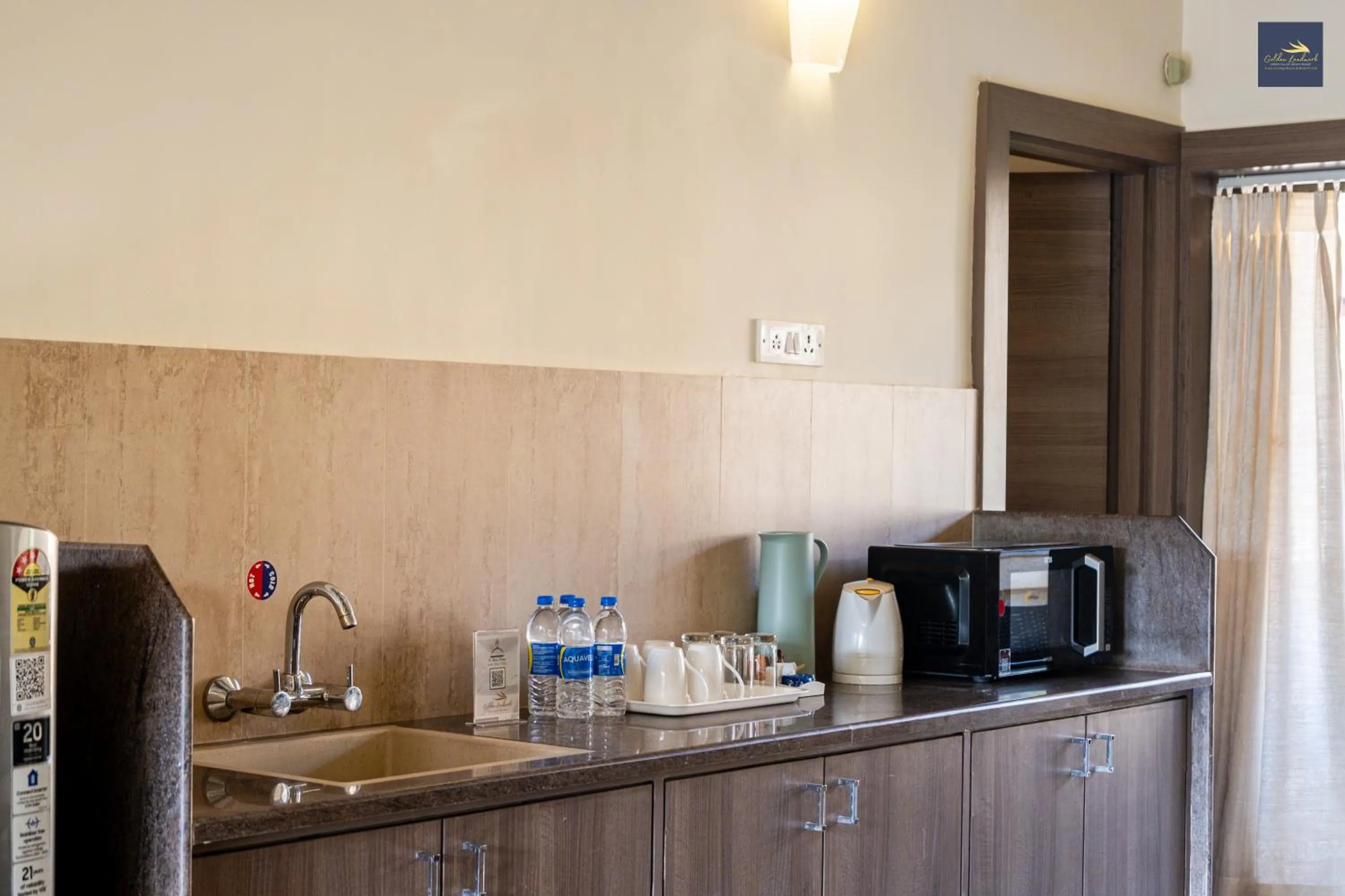Kitchen or kitchenette in Golden Landmark Green Valley Beach Resort