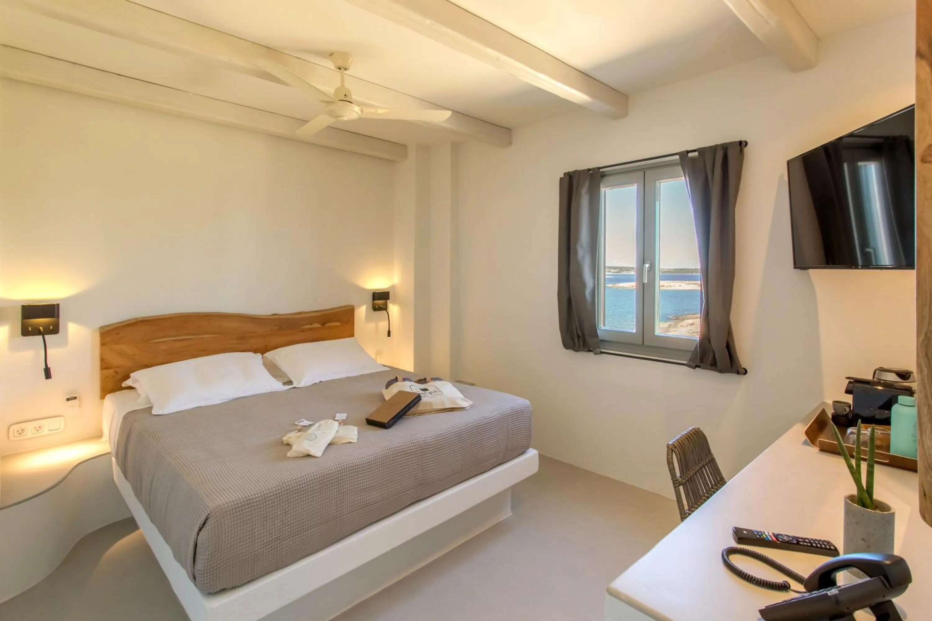 Bed in Paros Cape Suites
