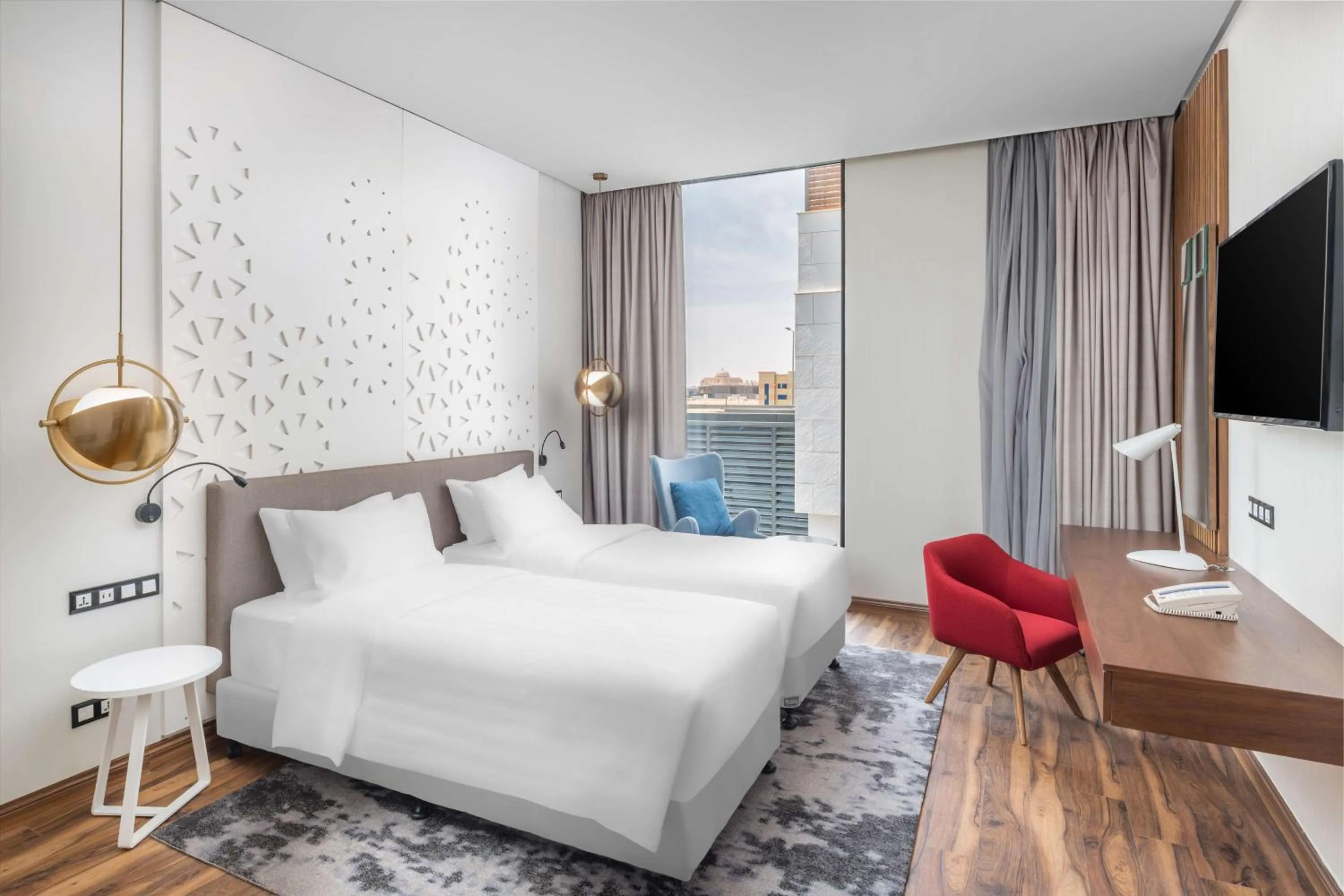 Photo of the whole room, Bed in Radisson Blu Hotel Riyadh Qurtuba