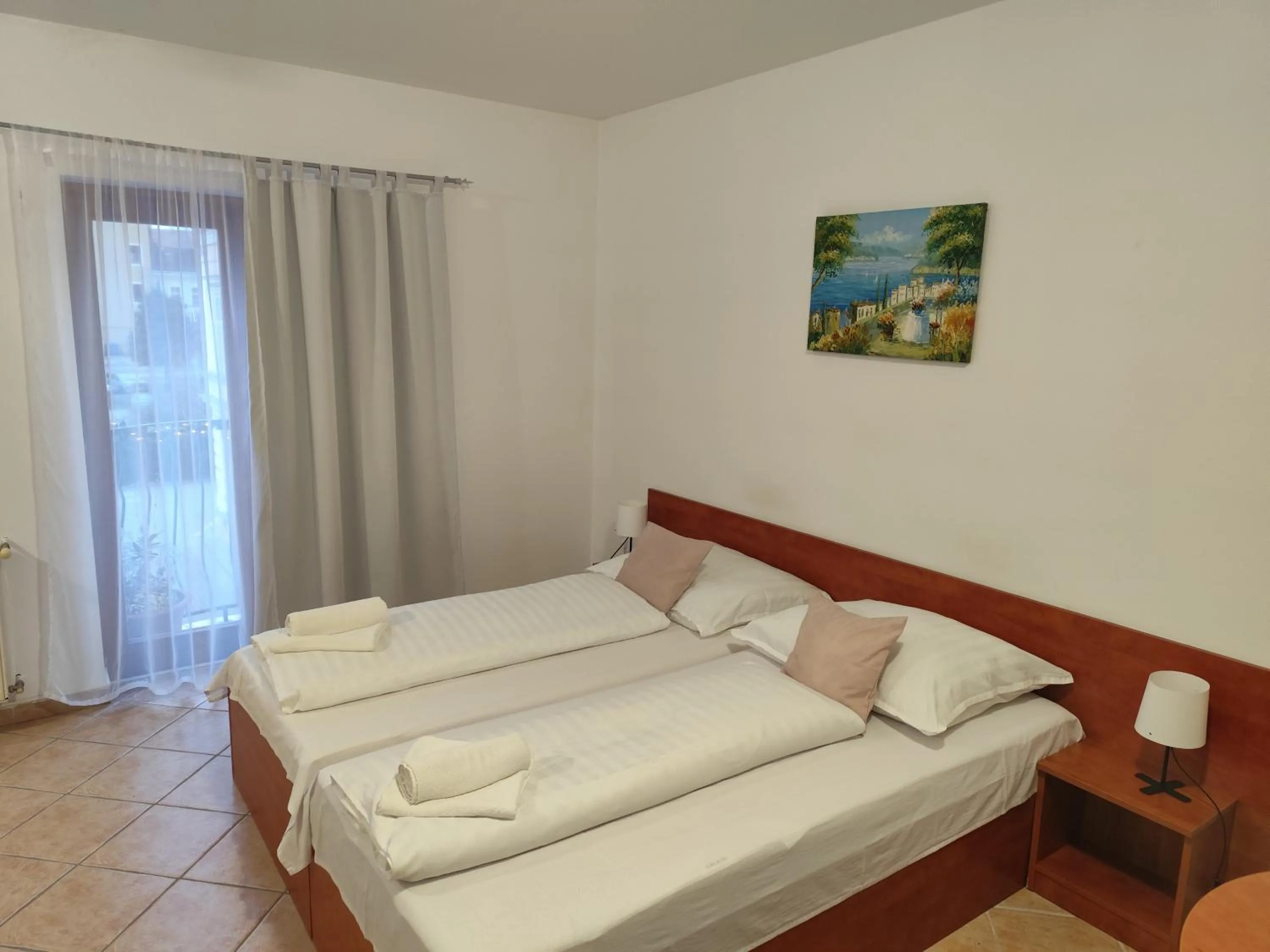 Bed in Szent Kristóf Apartmanhotel