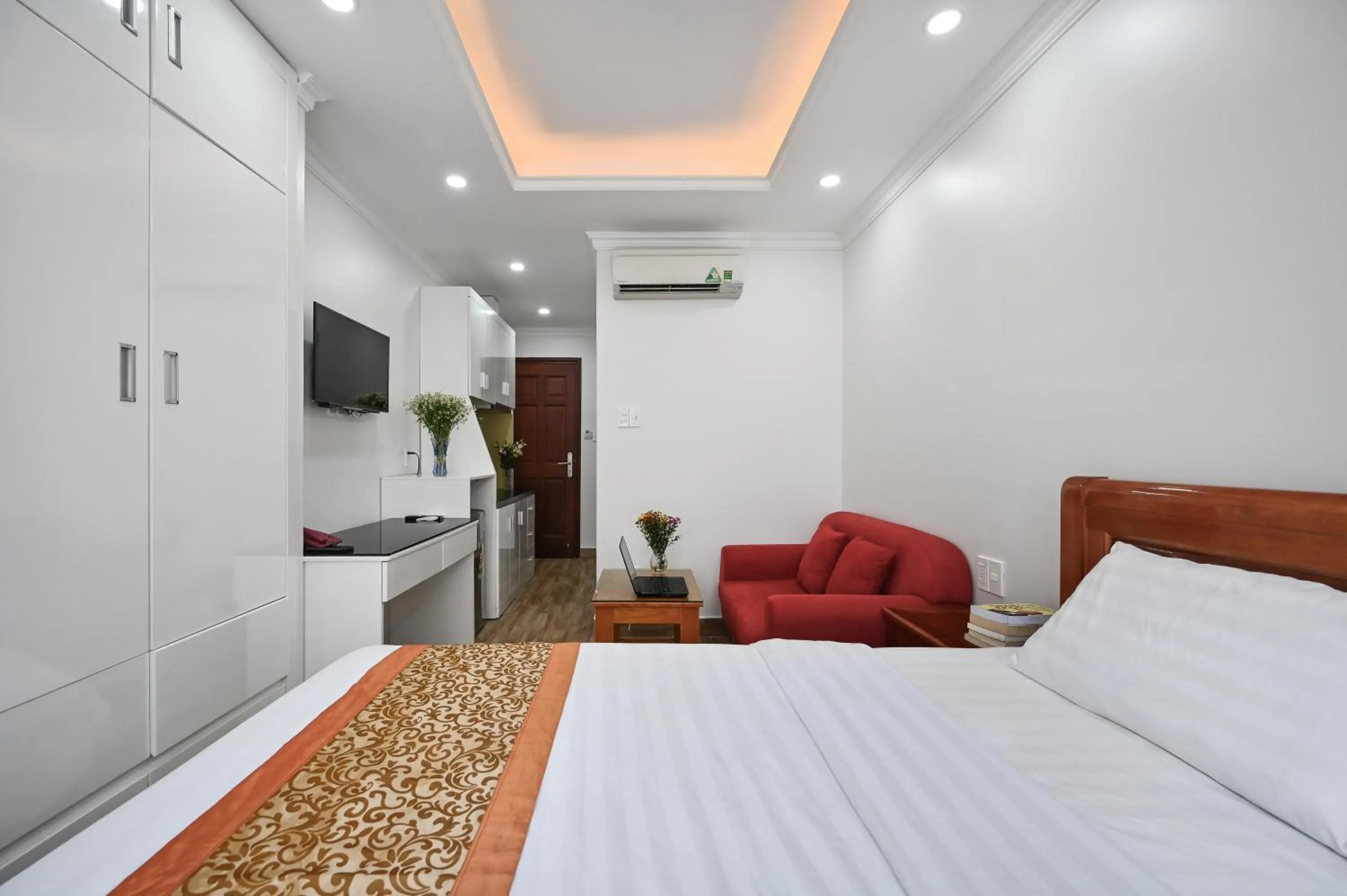 Bed in Genie Hotel & Serviced Apartments