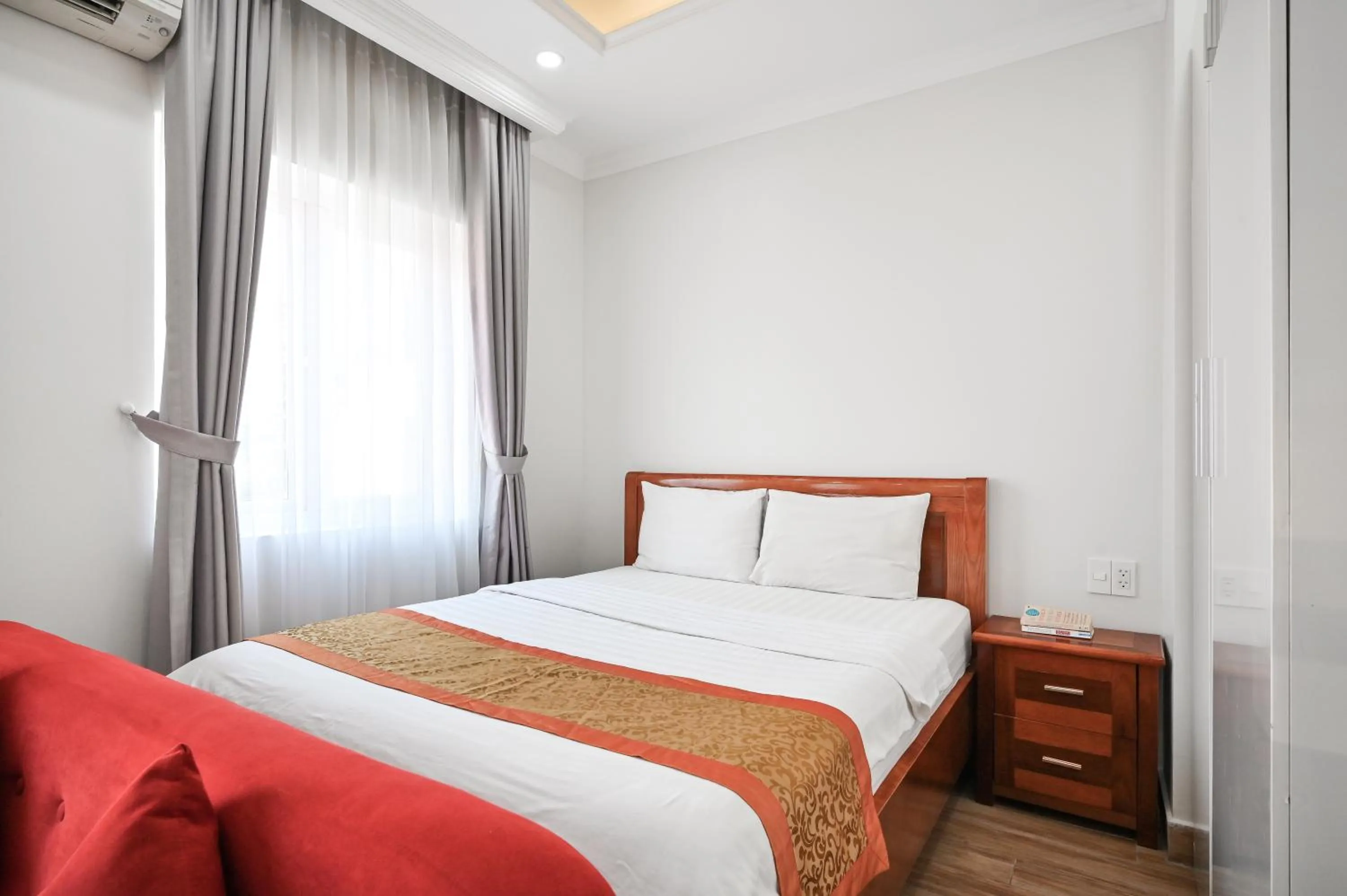 Bed in Genie Hotel & Serviced Apartments
