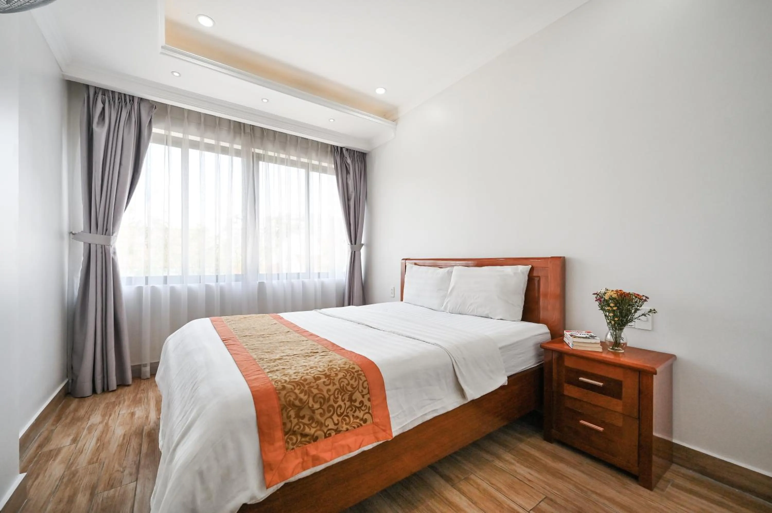 Bed in Genie Hotel & Serviced Apartments
