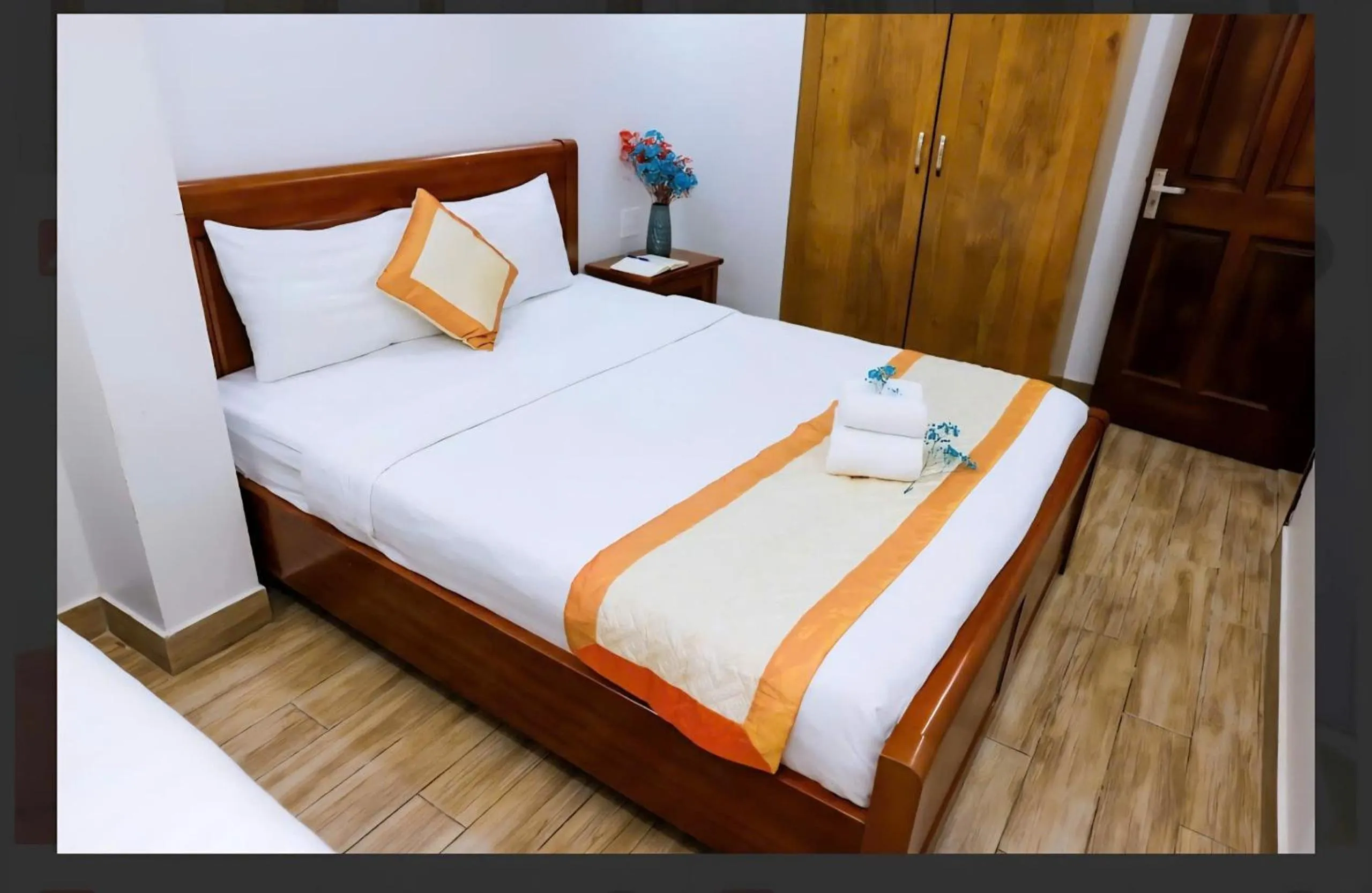Bed in Genie Hotel & Serviced Apartments