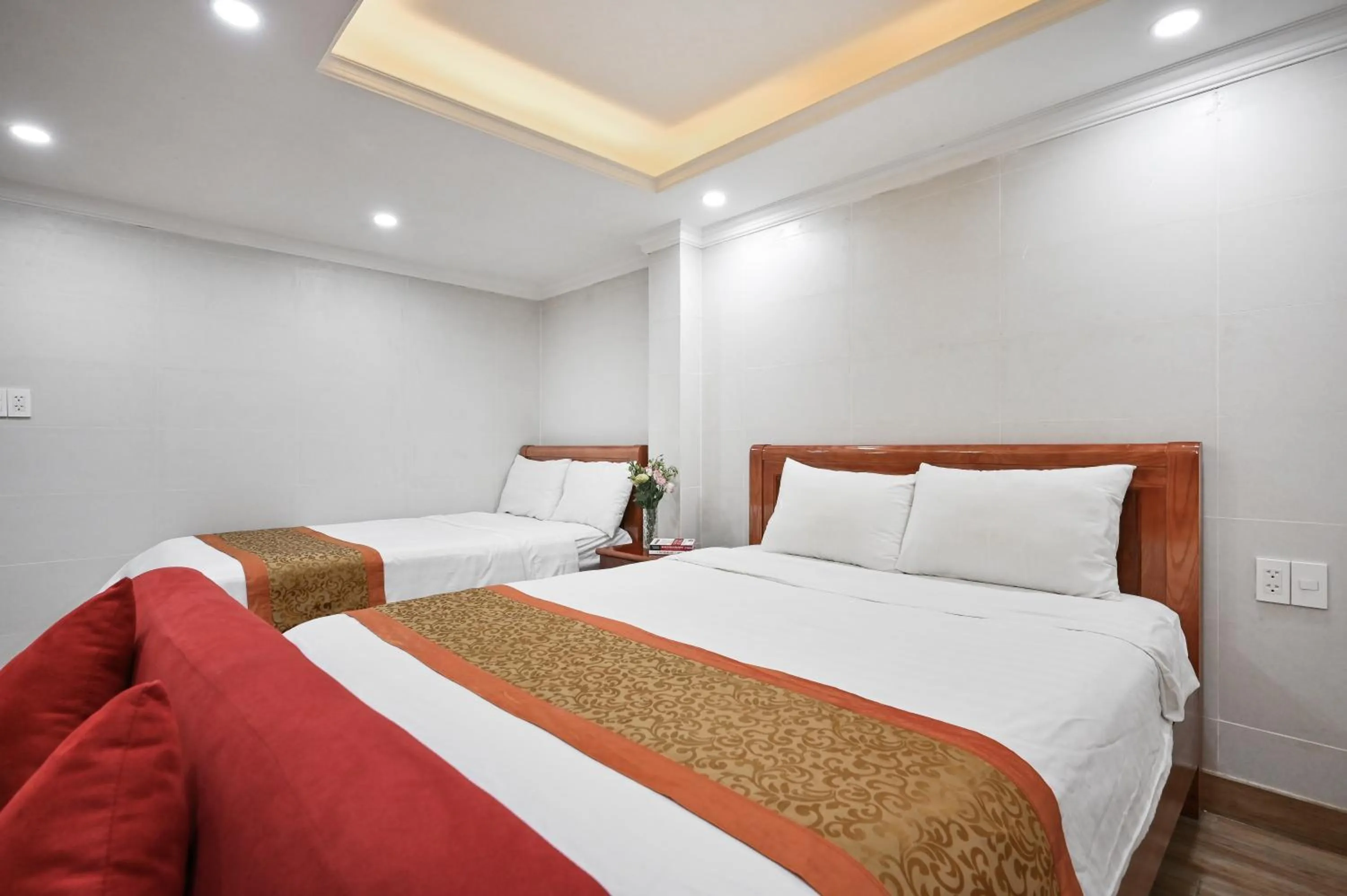 Bed in Genie Hotel & Serviced Apartments