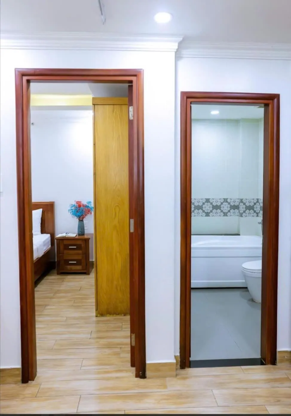 Bed in Genie Hotel & Serviced Apartments