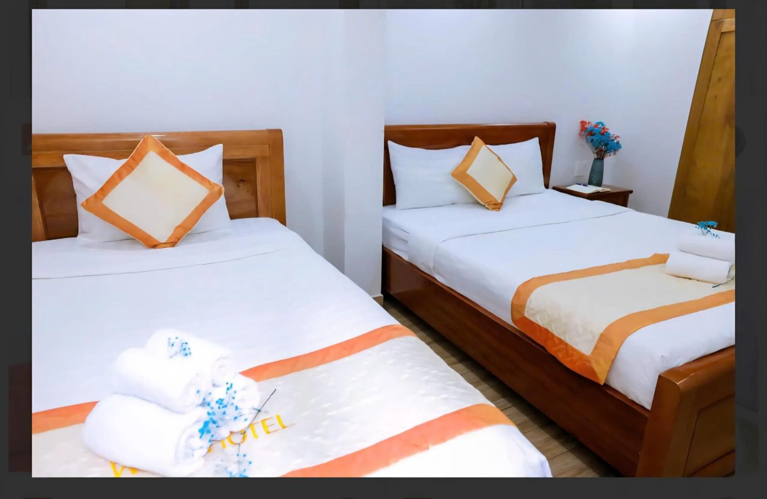 Bed in Genie Hotel & Serviced Apartments