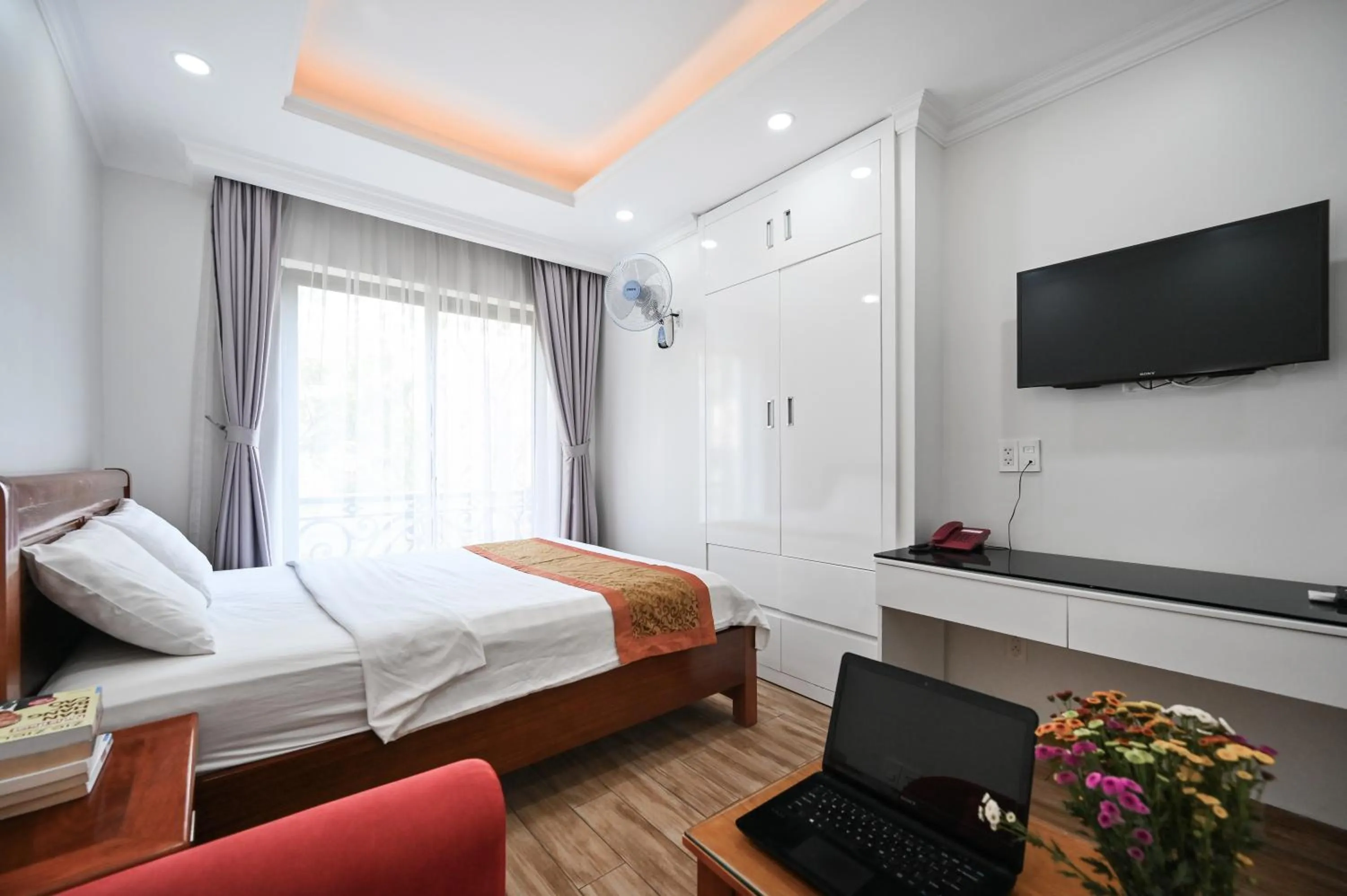 Bed in Genie Hotel & Serviced Apartments