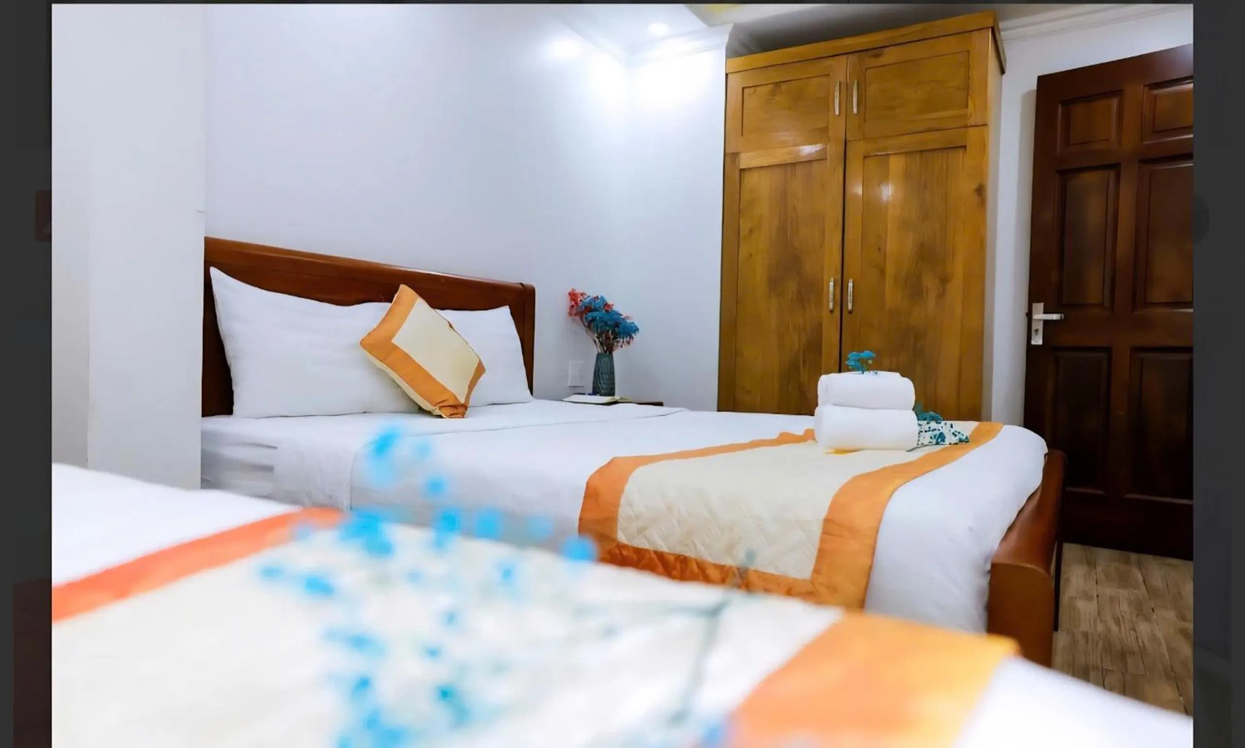 Bed in Genie Hotel & Serviced Apartments