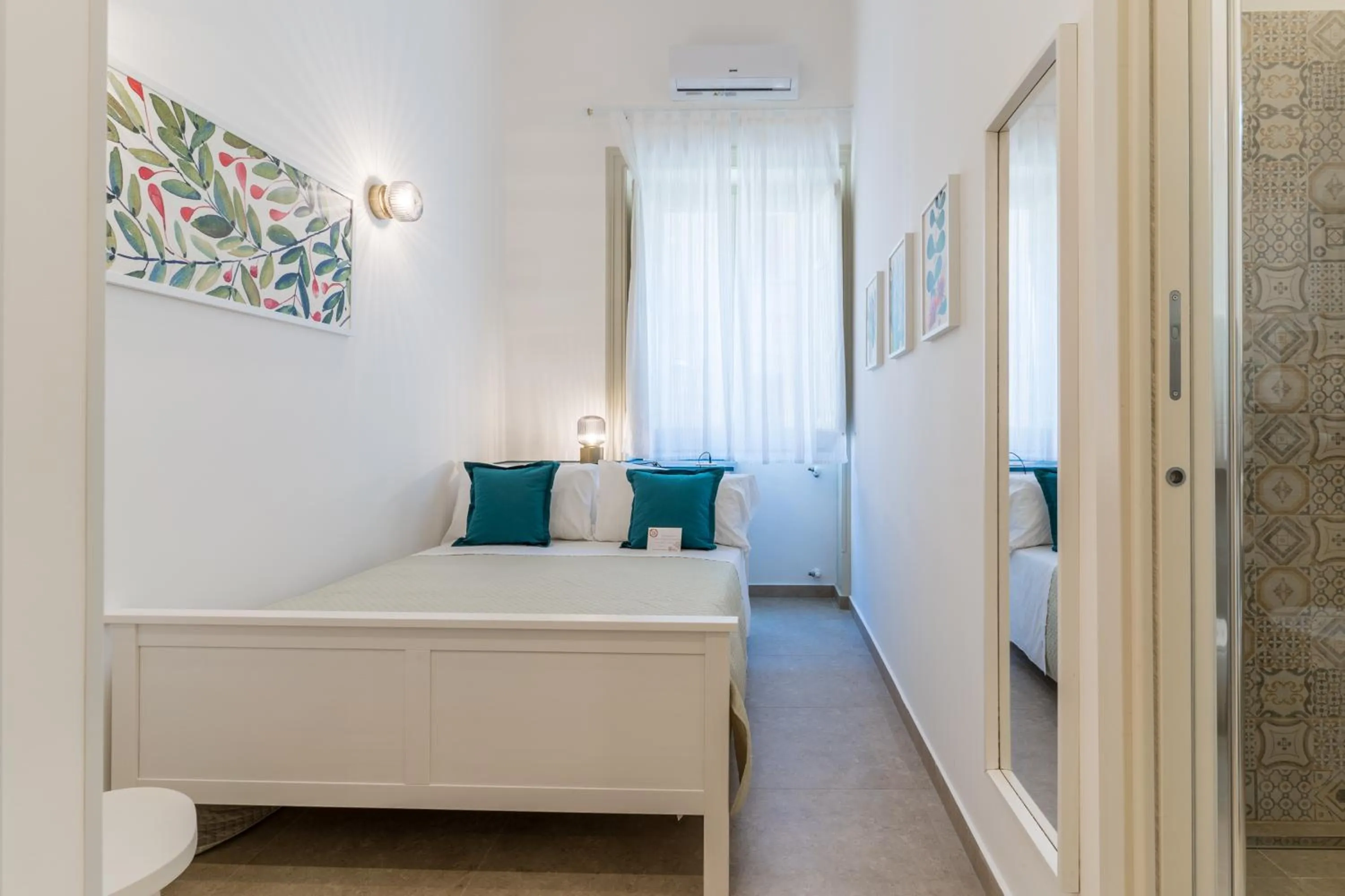 Bed in Mama Tita Rooms and Breakfast