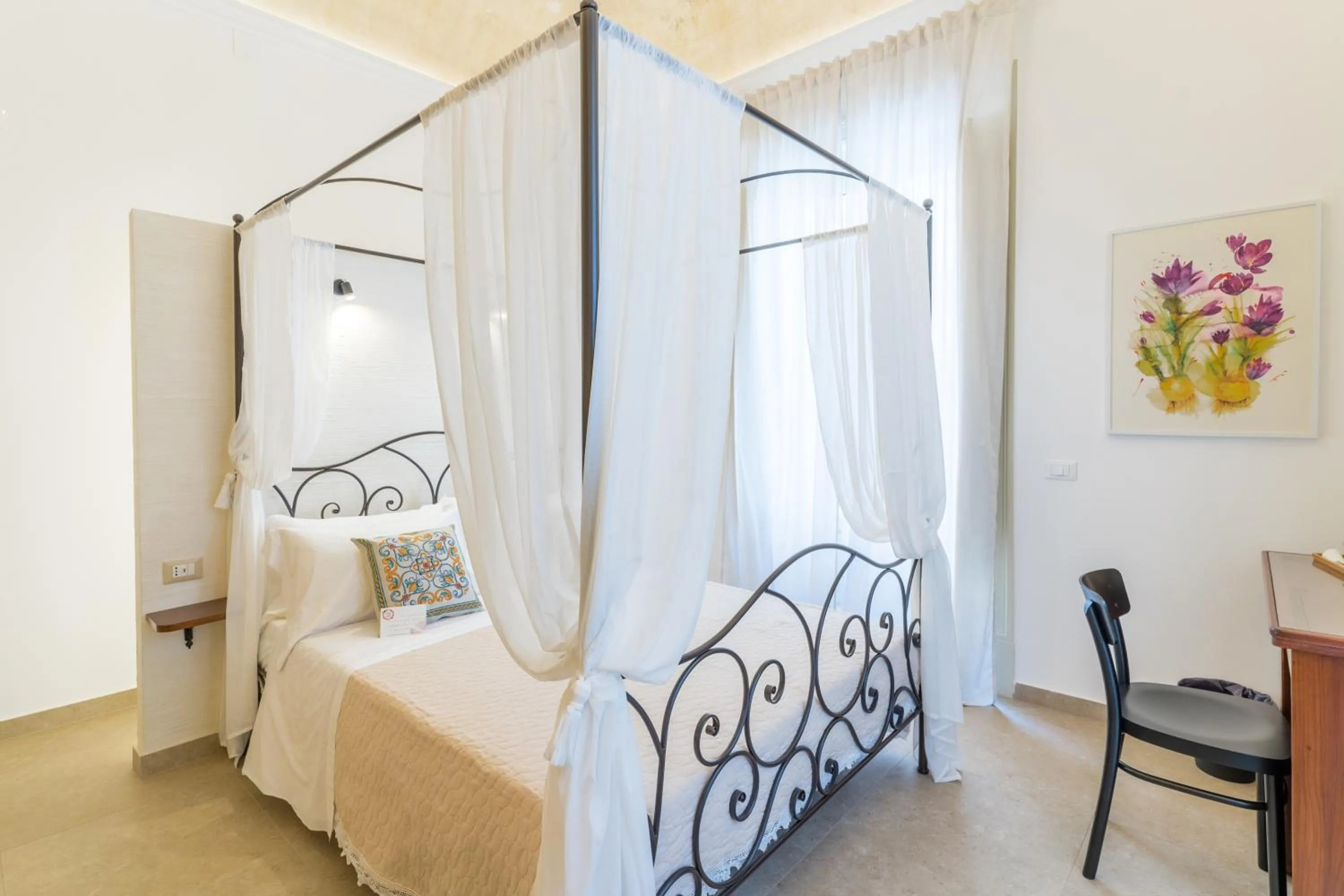 Bed in Mama Tita Rooms and Breakfast