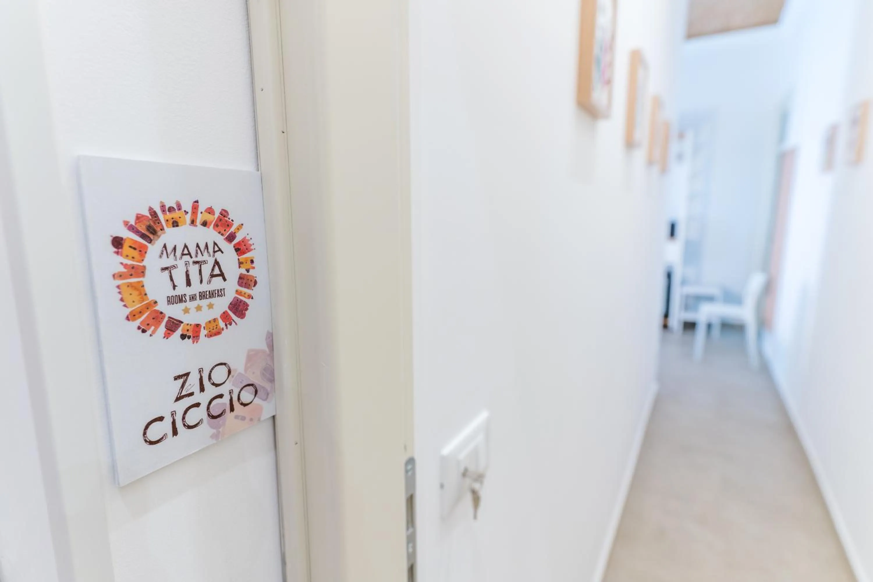 Property logo or sign in Mama Tita Rooms and Breakfast