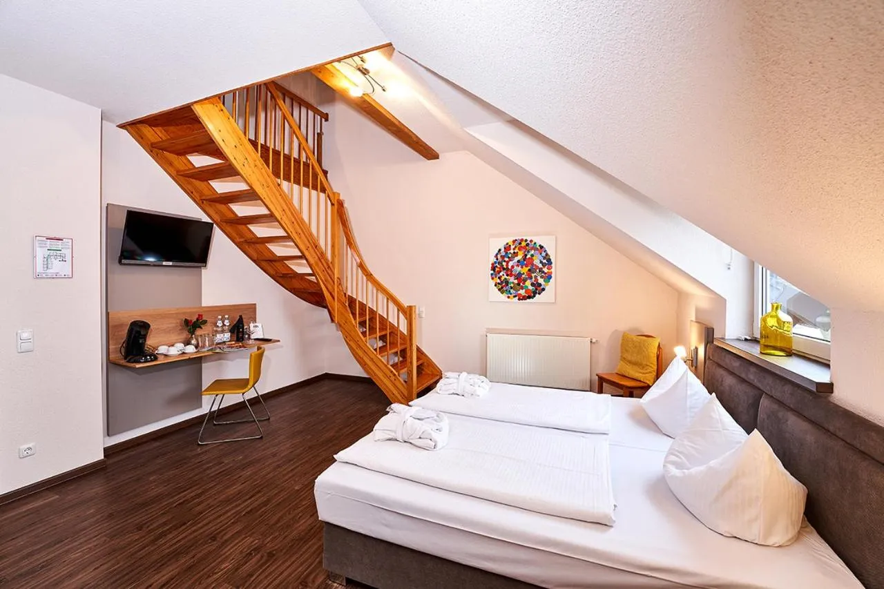 Bed in Brauers Landarthotel GmbH