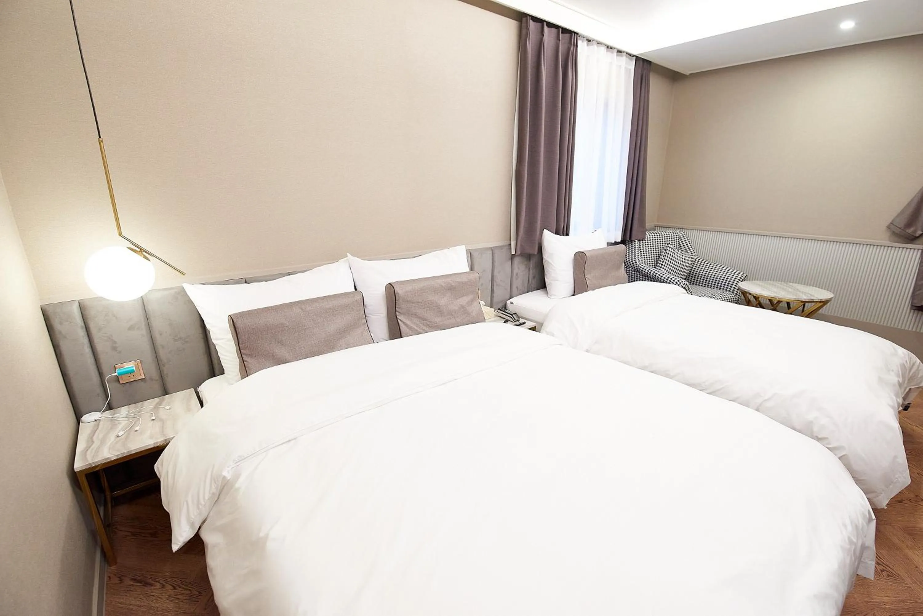 Bed in 사직 덴바스타 시그니처 호텔