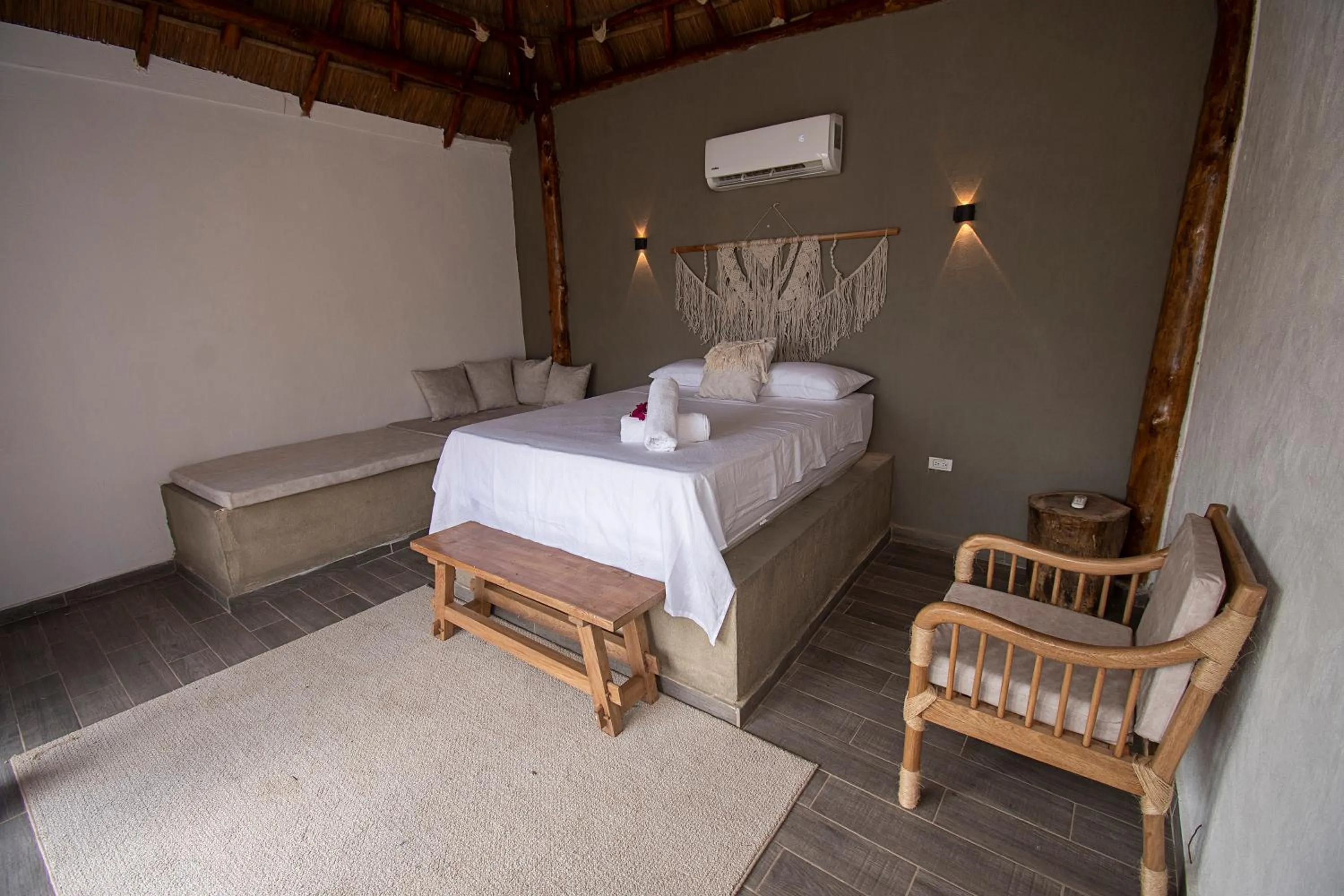 Bed in AMALIFE Beach Club & Hotel