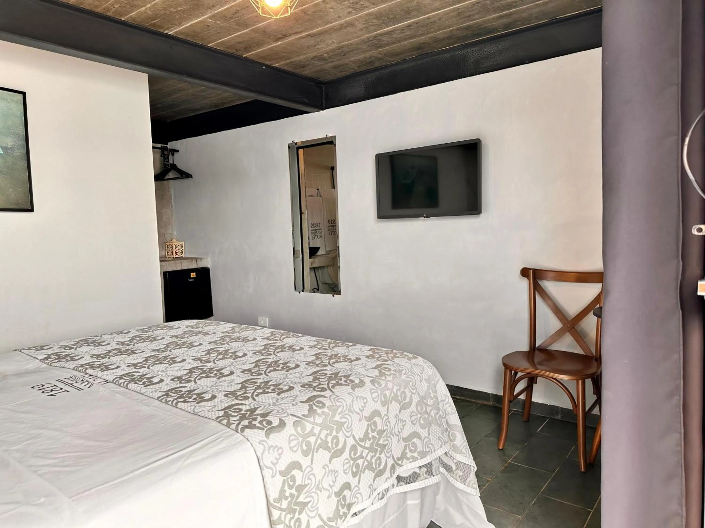 Bed in 1819 Marine Hotel