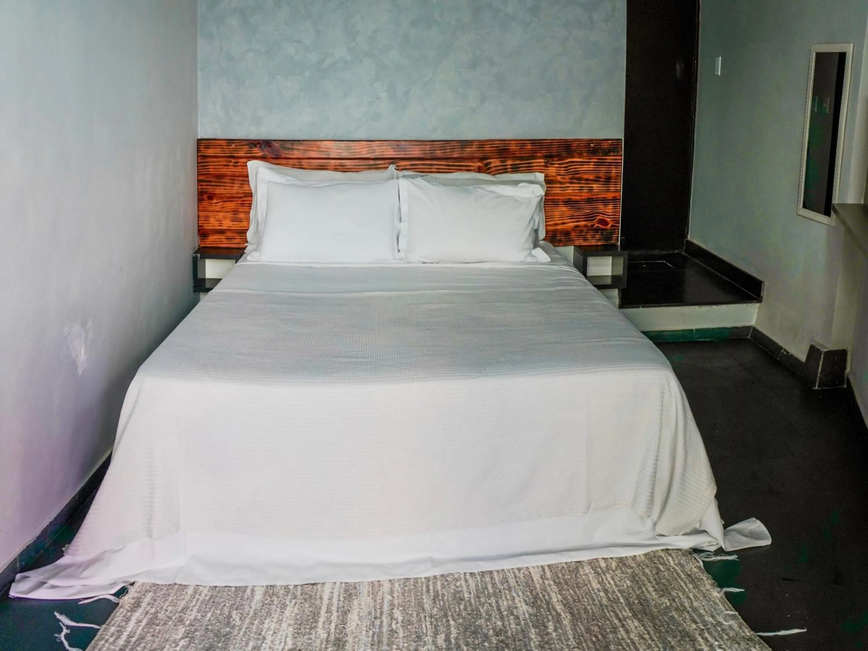 Bed in 1819 Marine Hotel