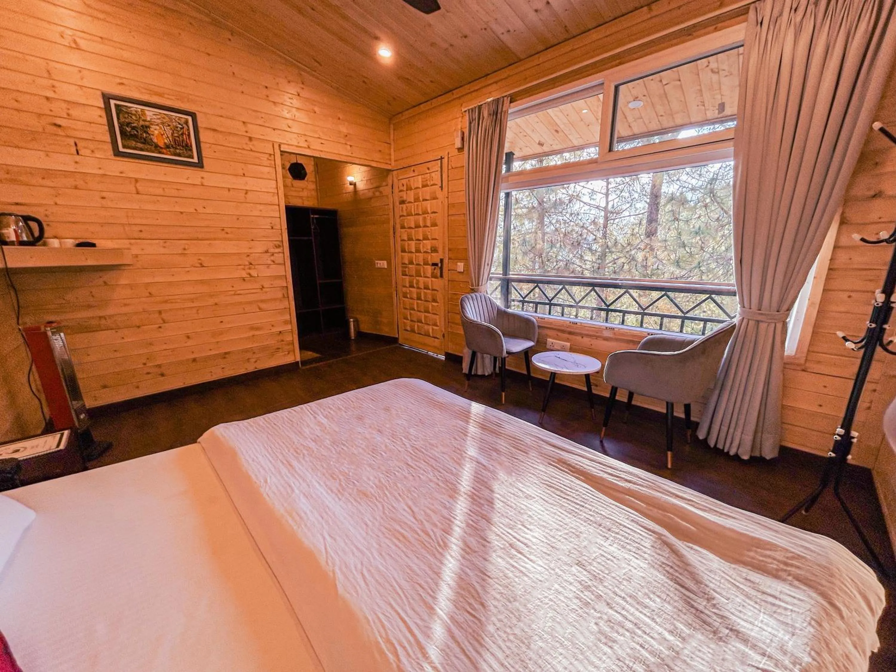 Photo of the whole room, Bed in THEHIMALAYANLIVING WHISTLING PINES