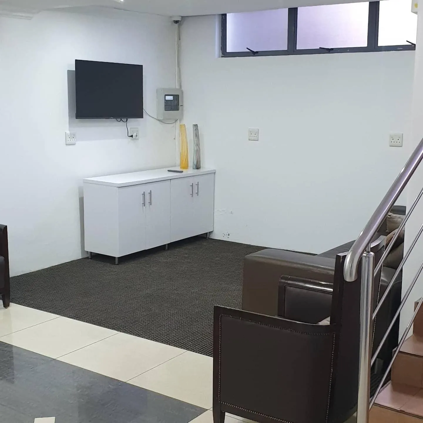 Communal lounge/ TV room in Al Hamra Hotel Durban