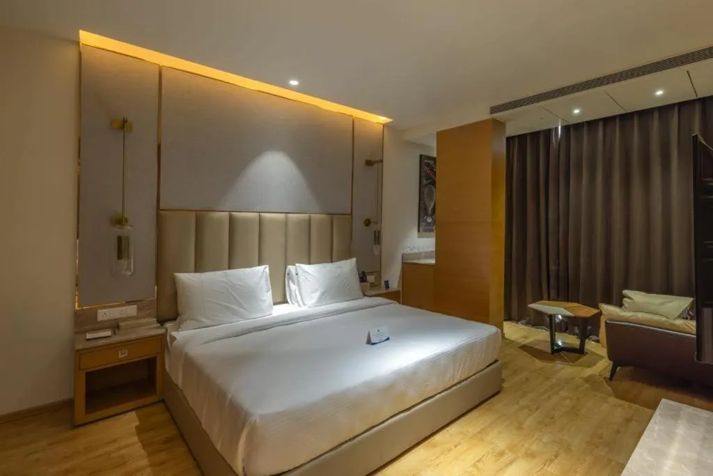 Bedroom in Sarovar Portico Morbi